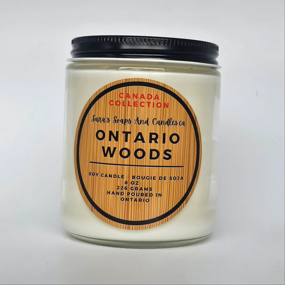 Candle jar labeled 'Ontario Woods' from Canada Collection on a white background