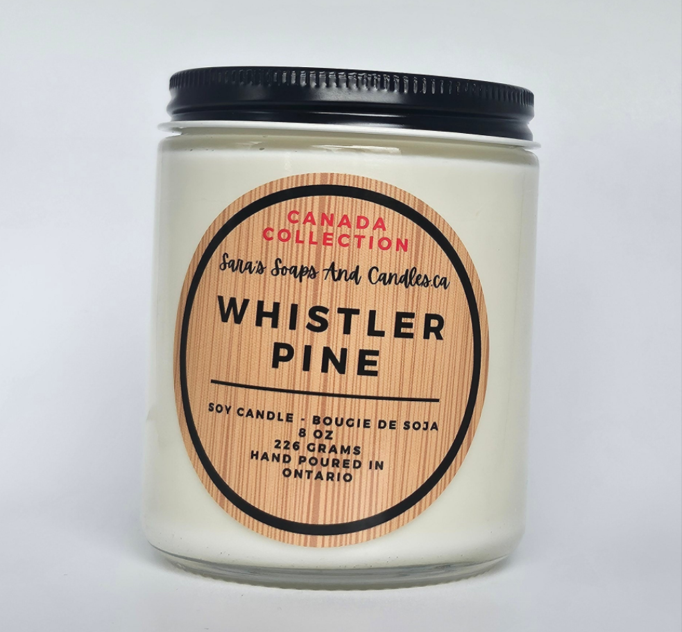 Candle with 'Whistler Pine' label on a white background
