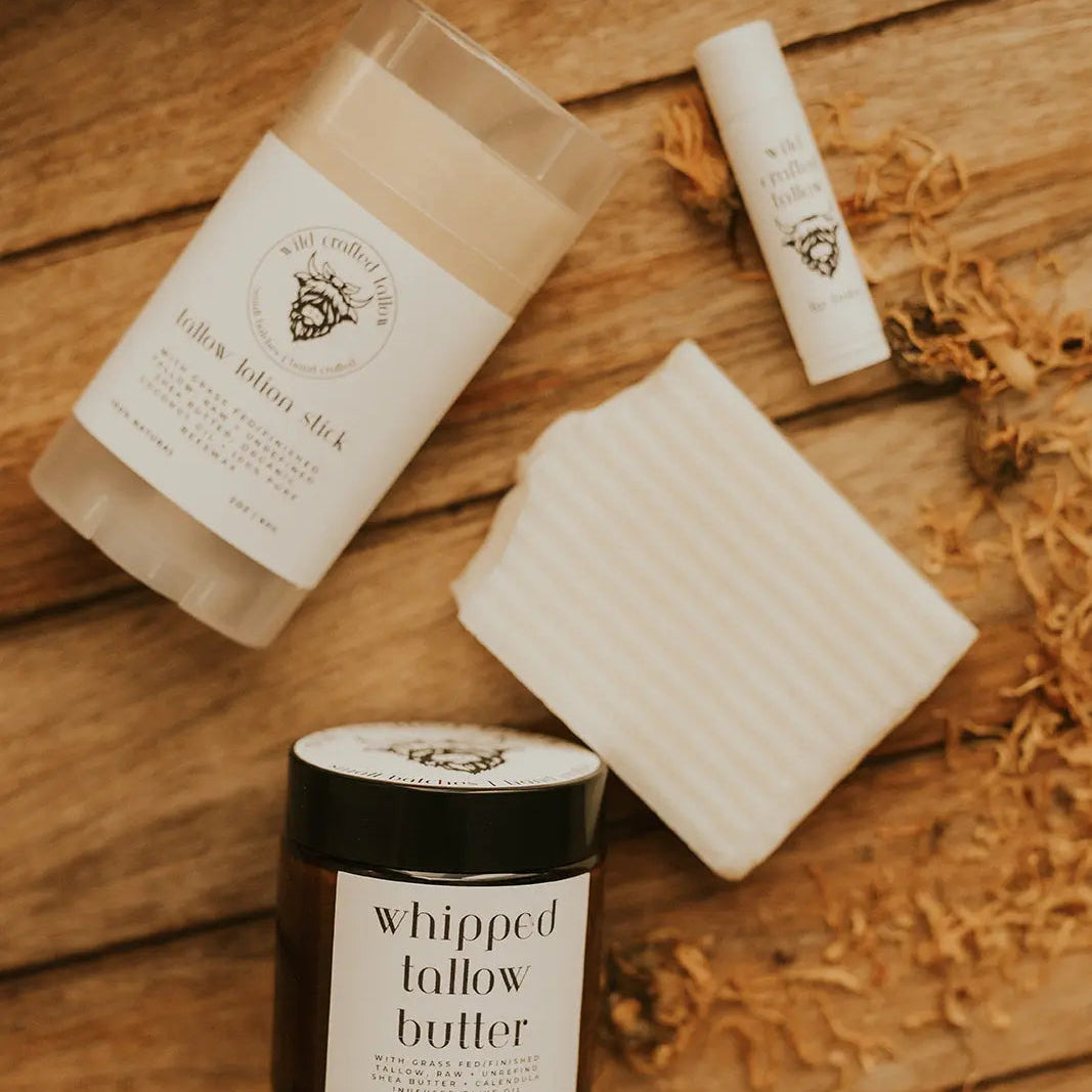 Whipped lather butter product on a wooden surface with branding visible
