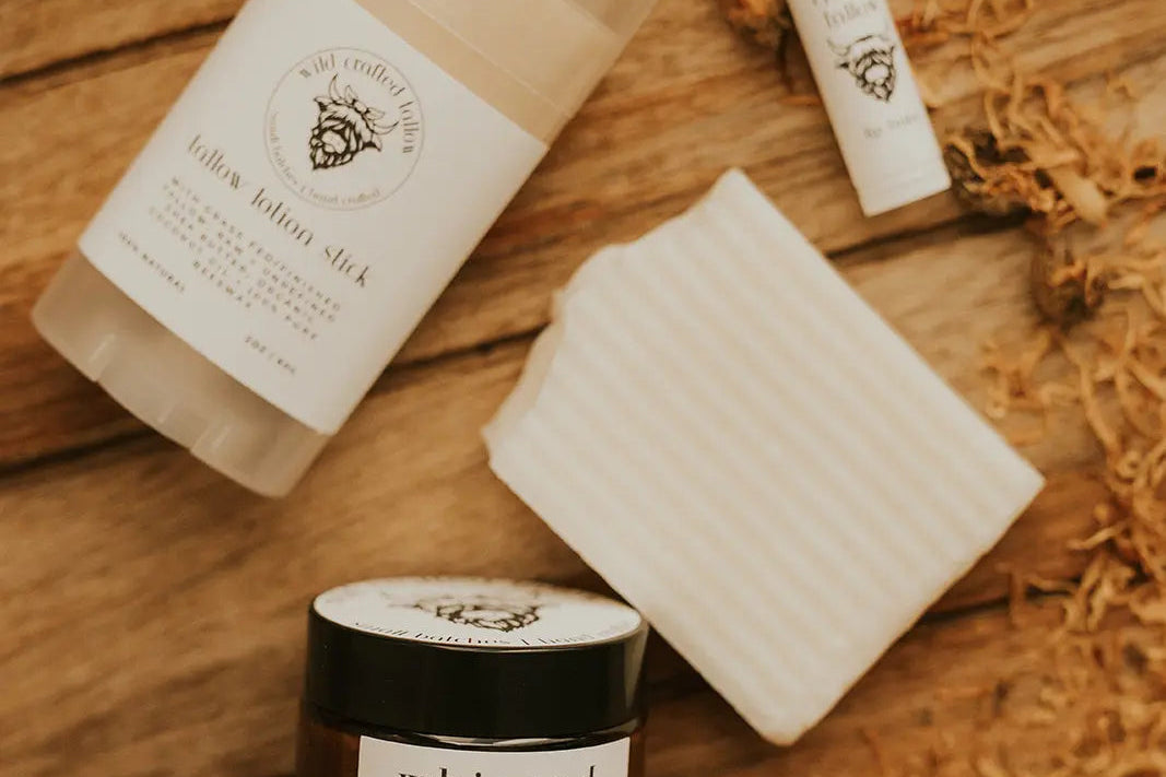 Whipped lather butter product on a wooden surface with branding visible