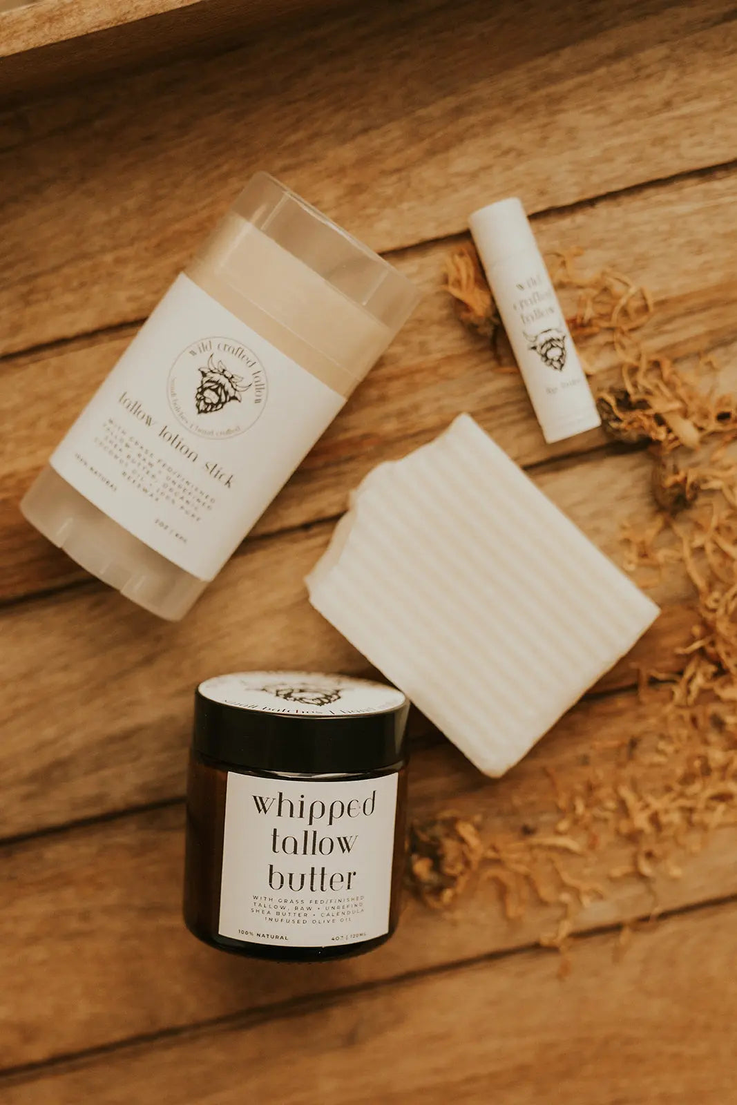 Whipped lather butter product on a wooden surface with branding visible