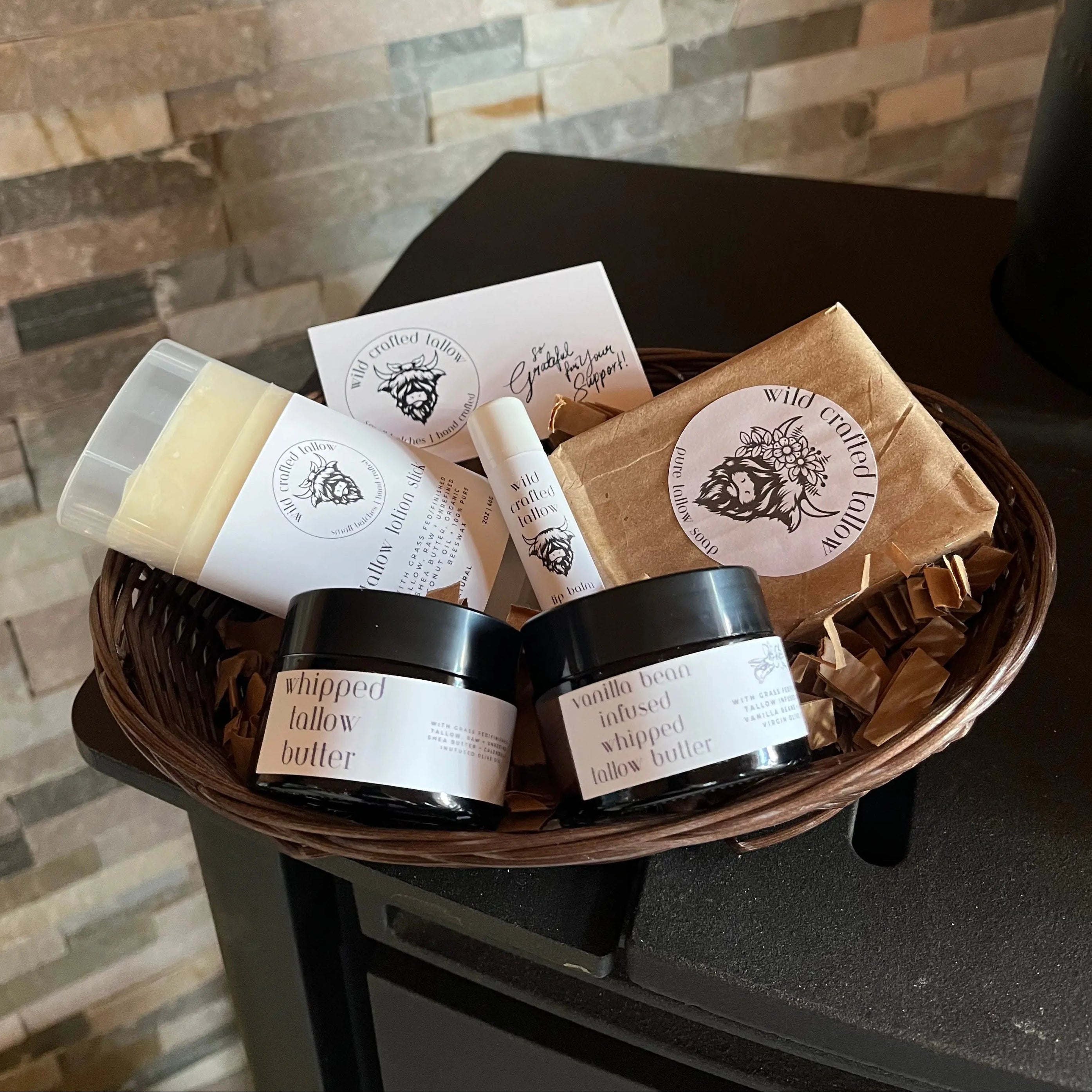 Basket of various skincare products on a stone surface