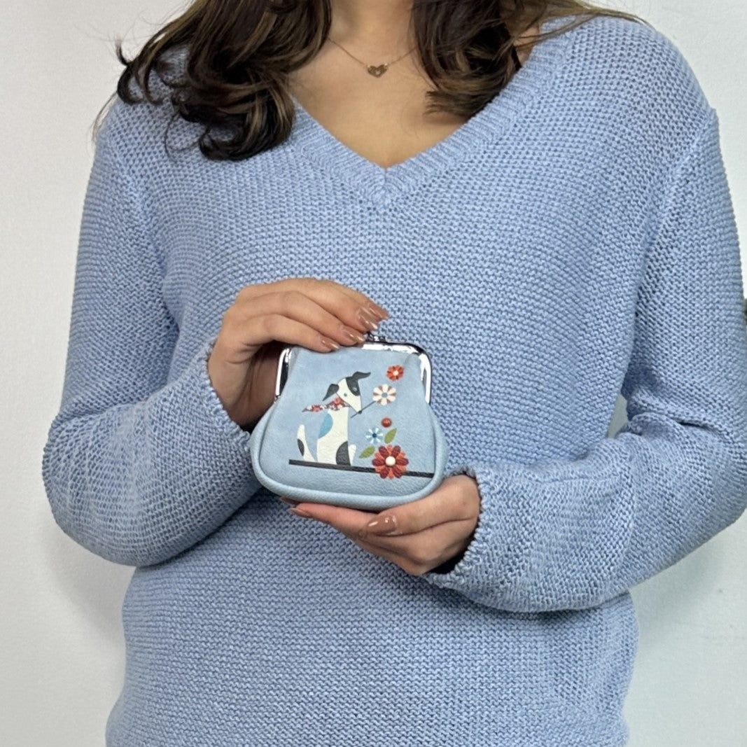 A small light blue Espe Vegan Corp coin purse with a silver kiss-lock clasp, 