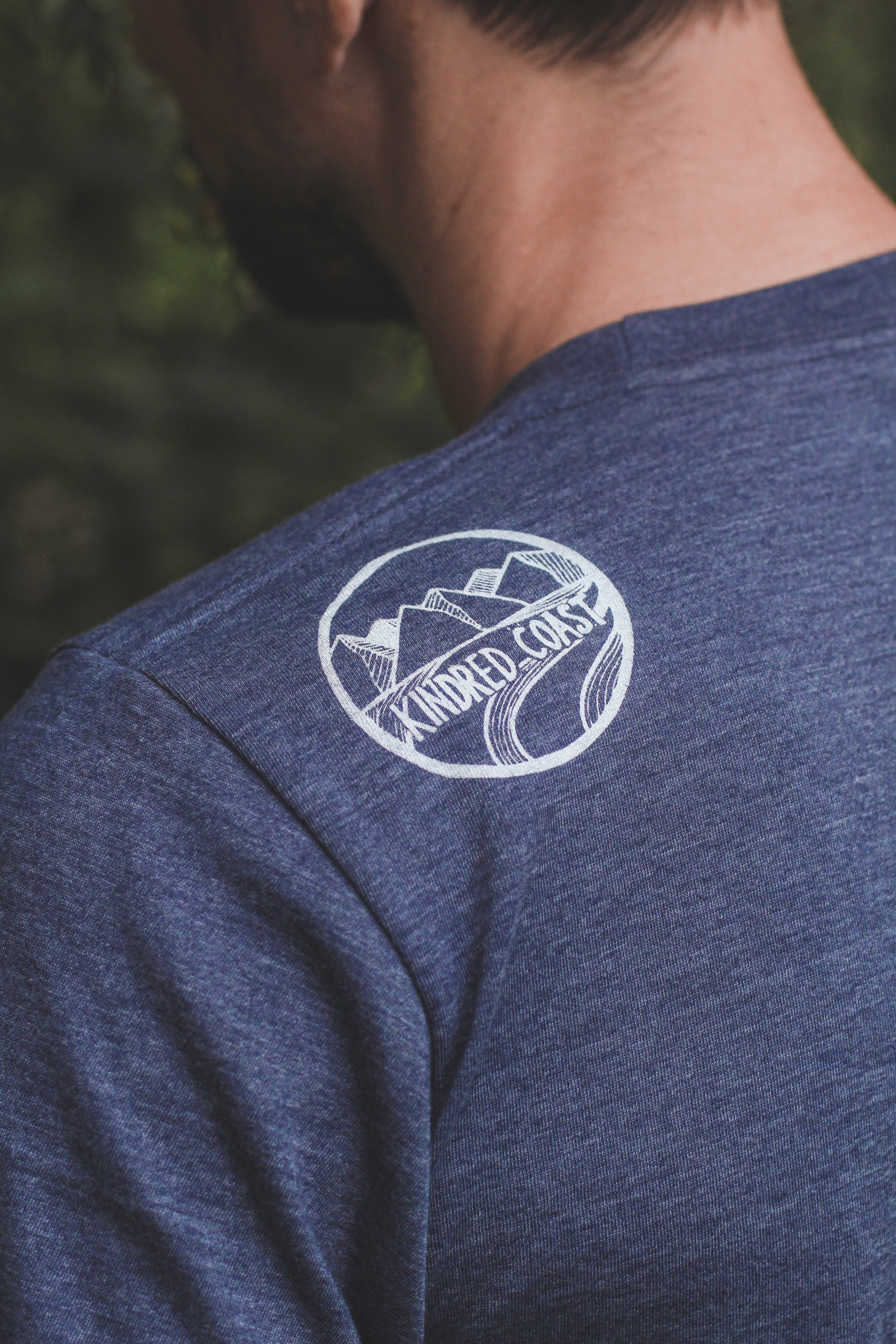 Kindred Coast - RAVEN - Unisex Eco Tee shoulder 