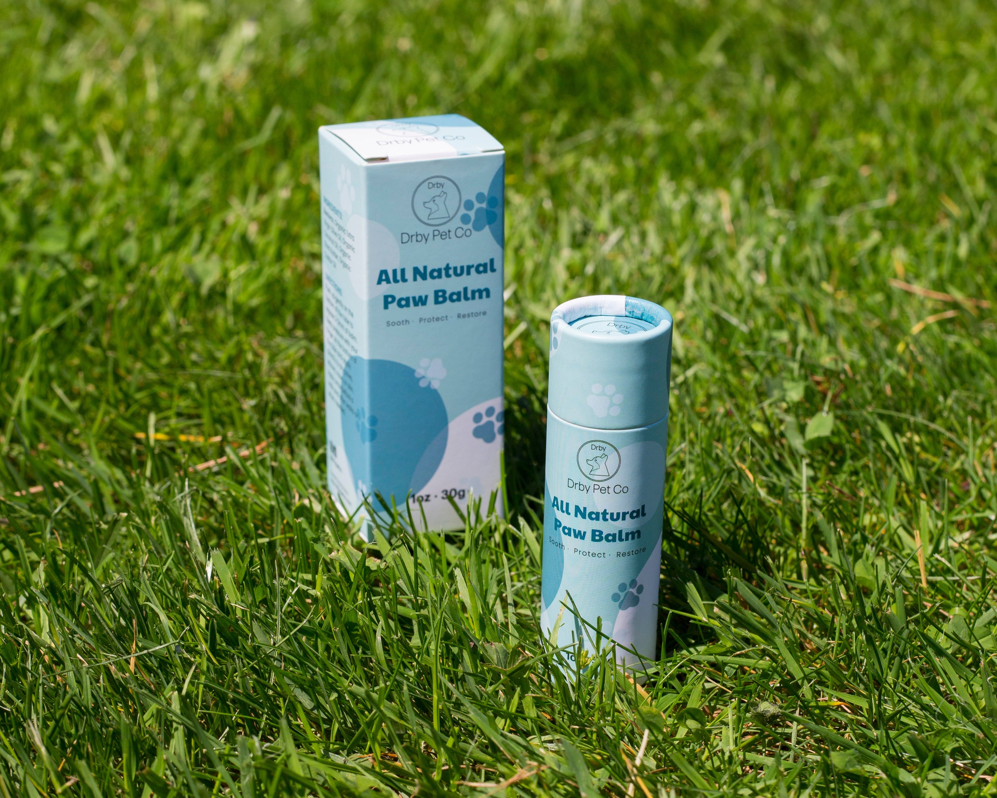 All Natural Paw Balm packaging on grass