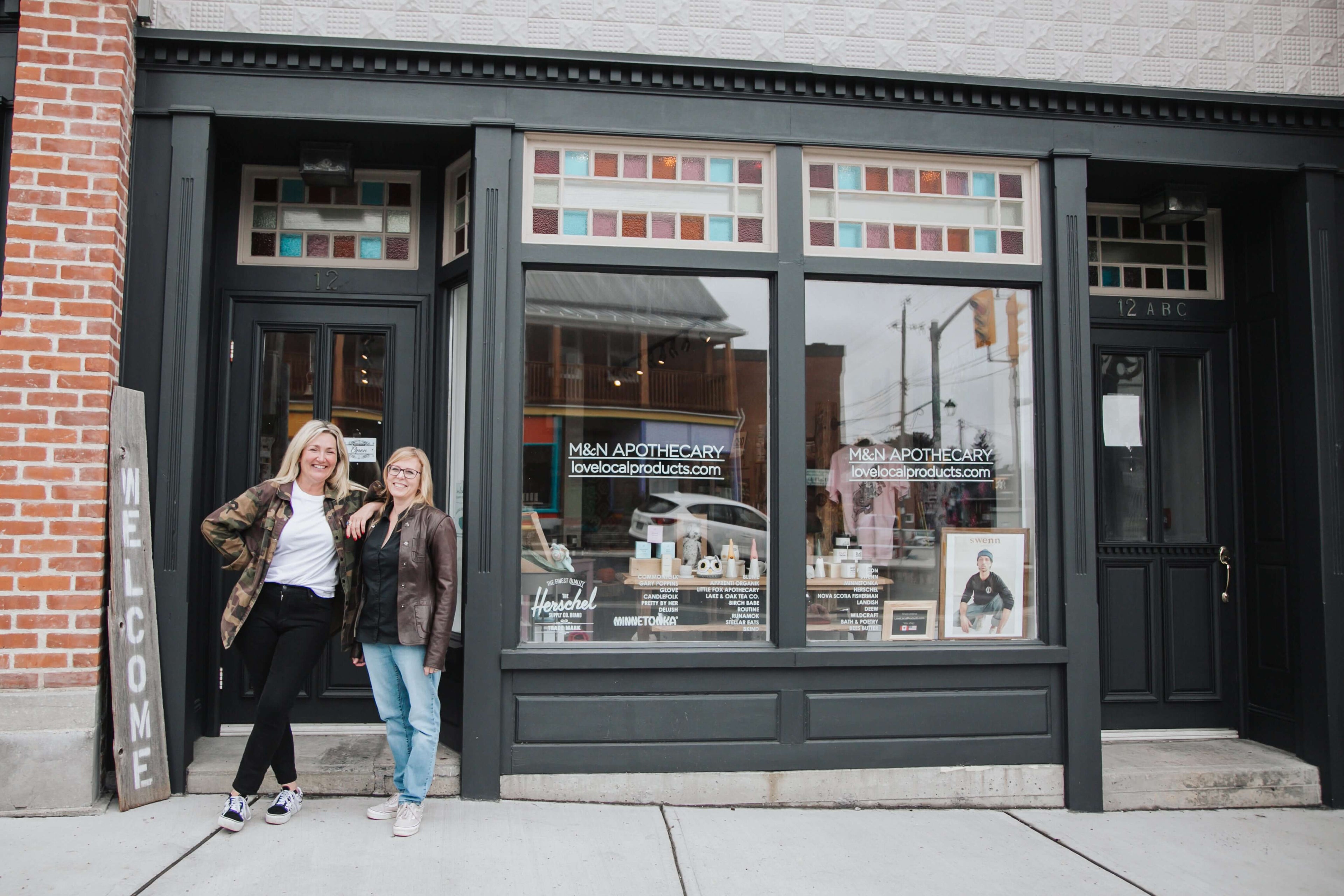 Love Local Products storefront  M&N Apothecary windows with Vans Herschel Blume Wildcraft Nancy Overbury and Margaret Thouez in front