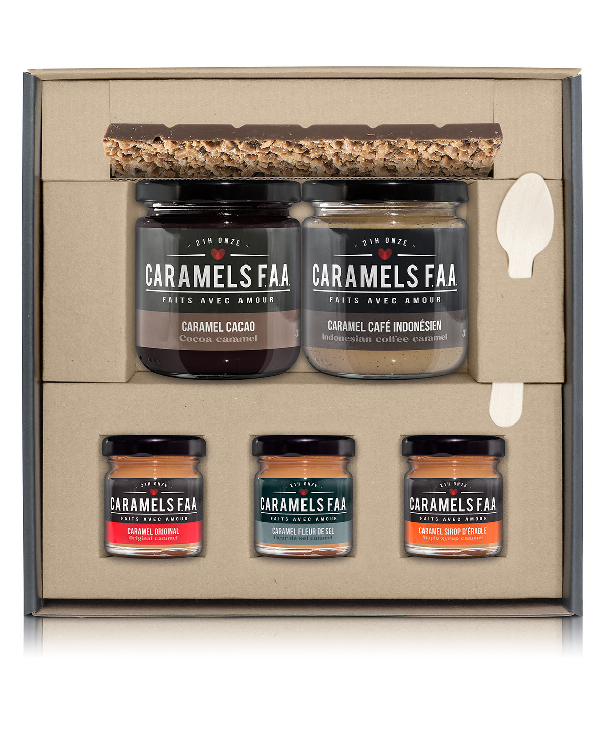 Set of Caramels FAA jars in a decorative box with a spoon on a white background