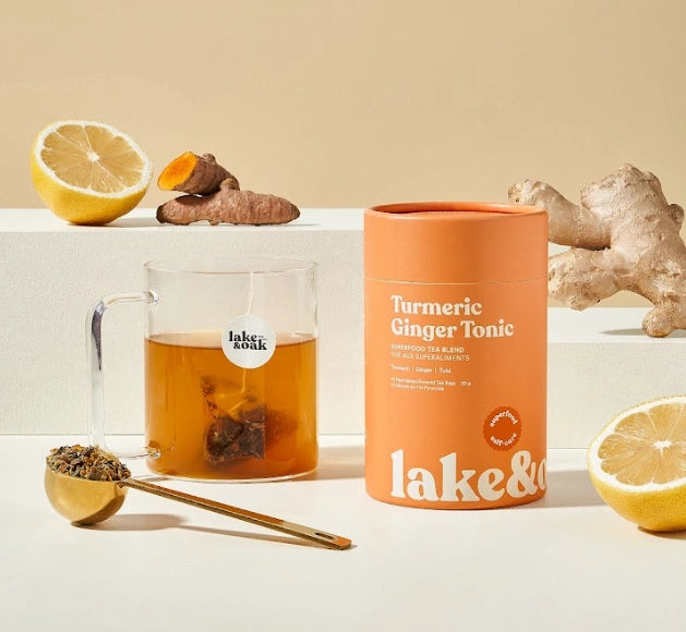 Lake and Oak Turmeric Ginger tea bags canister with steeped tea cup