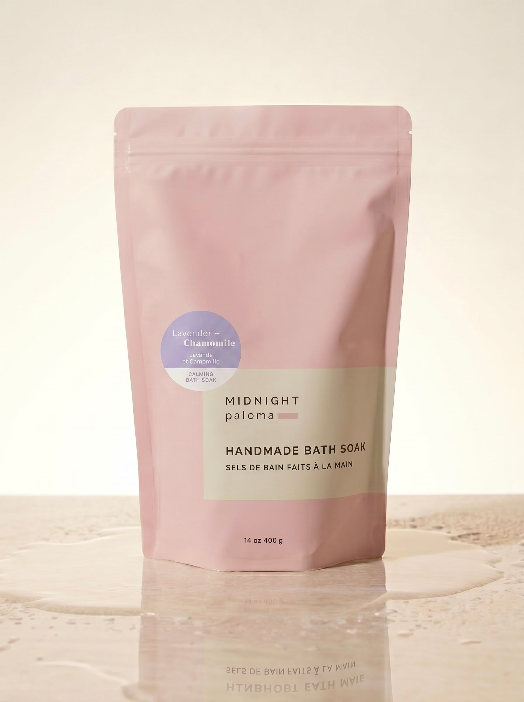 Handmade bath soak packaging with 'Midnight Paloma' branding on a beige background