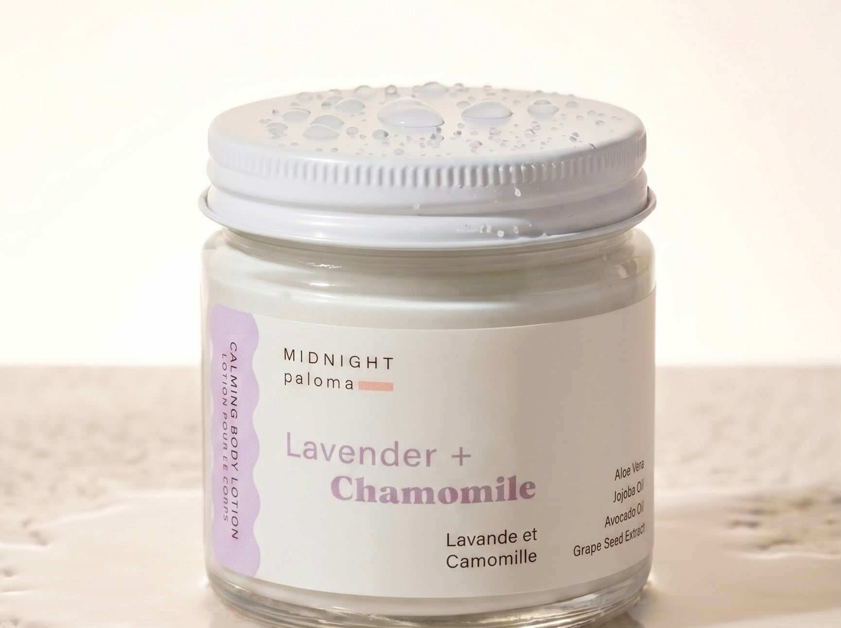Jar of lavender and chamomile product on a light background