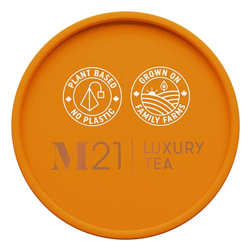 M21 Luxury Tea canister lid featuring eco-friendly logos: plant-based materials and family farm sourcing.
