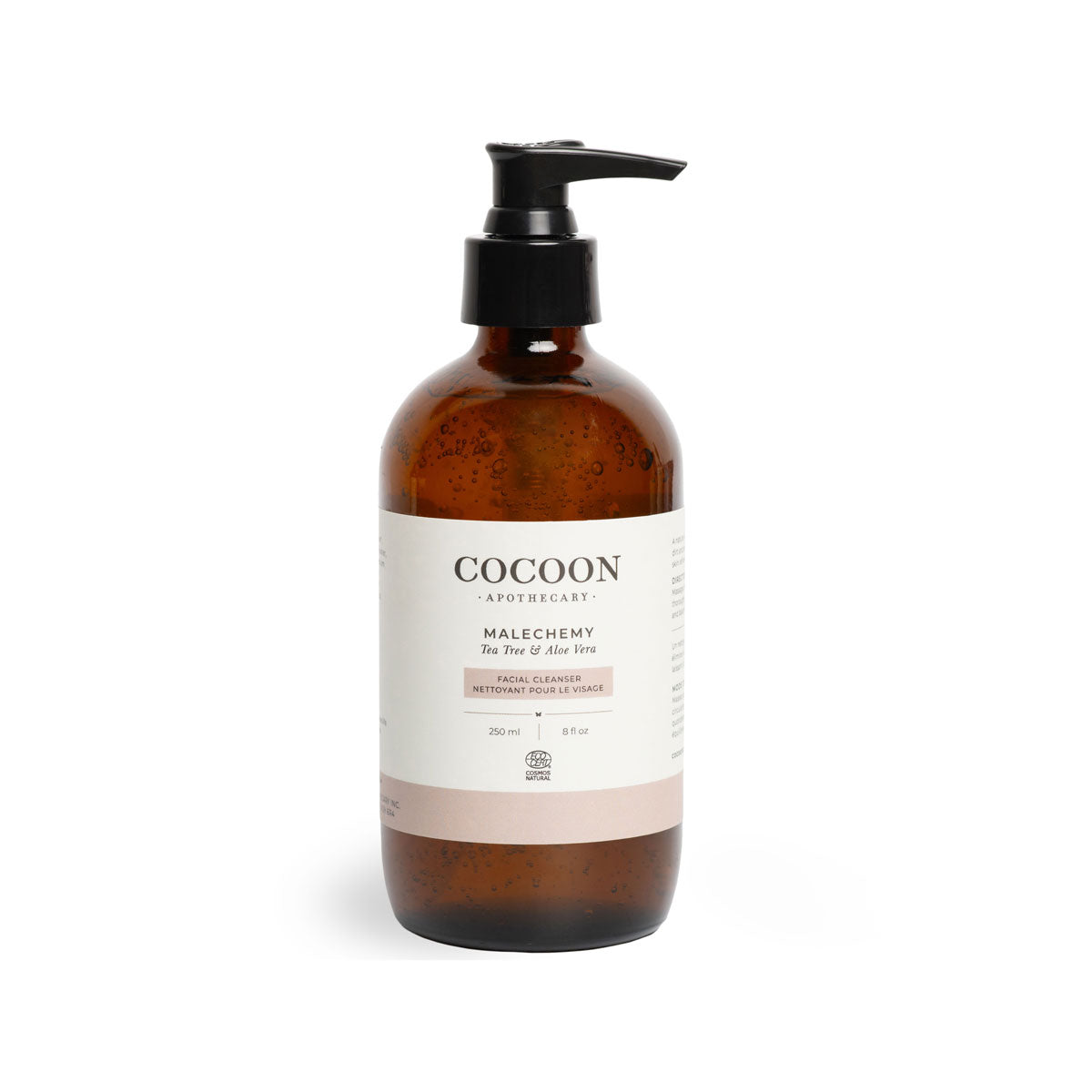 Brown bottle with pump and white label on a white background