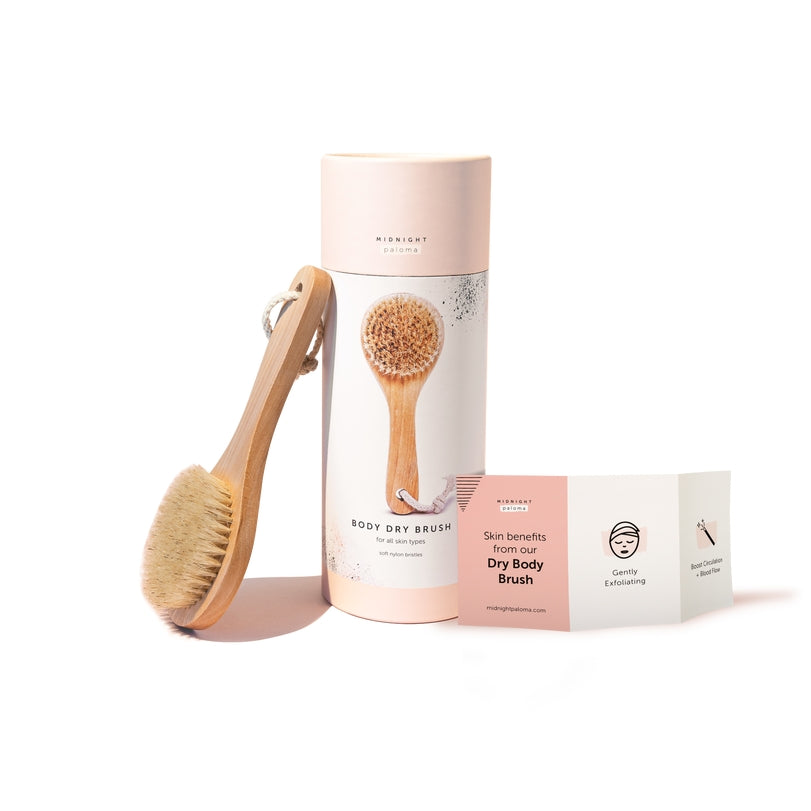 Dry body brush with natural bristles and packaging, designed for exfoliation and improved skin texture.