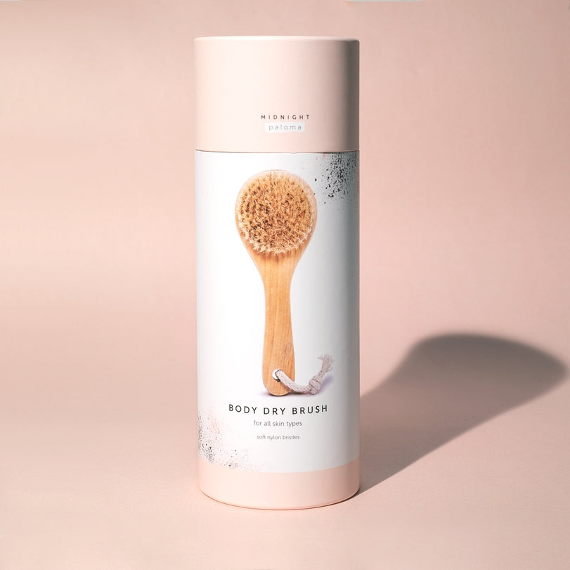 Body dry brush in stylish packaging for exfoliating and improving skin texture, suitable for all skin types.