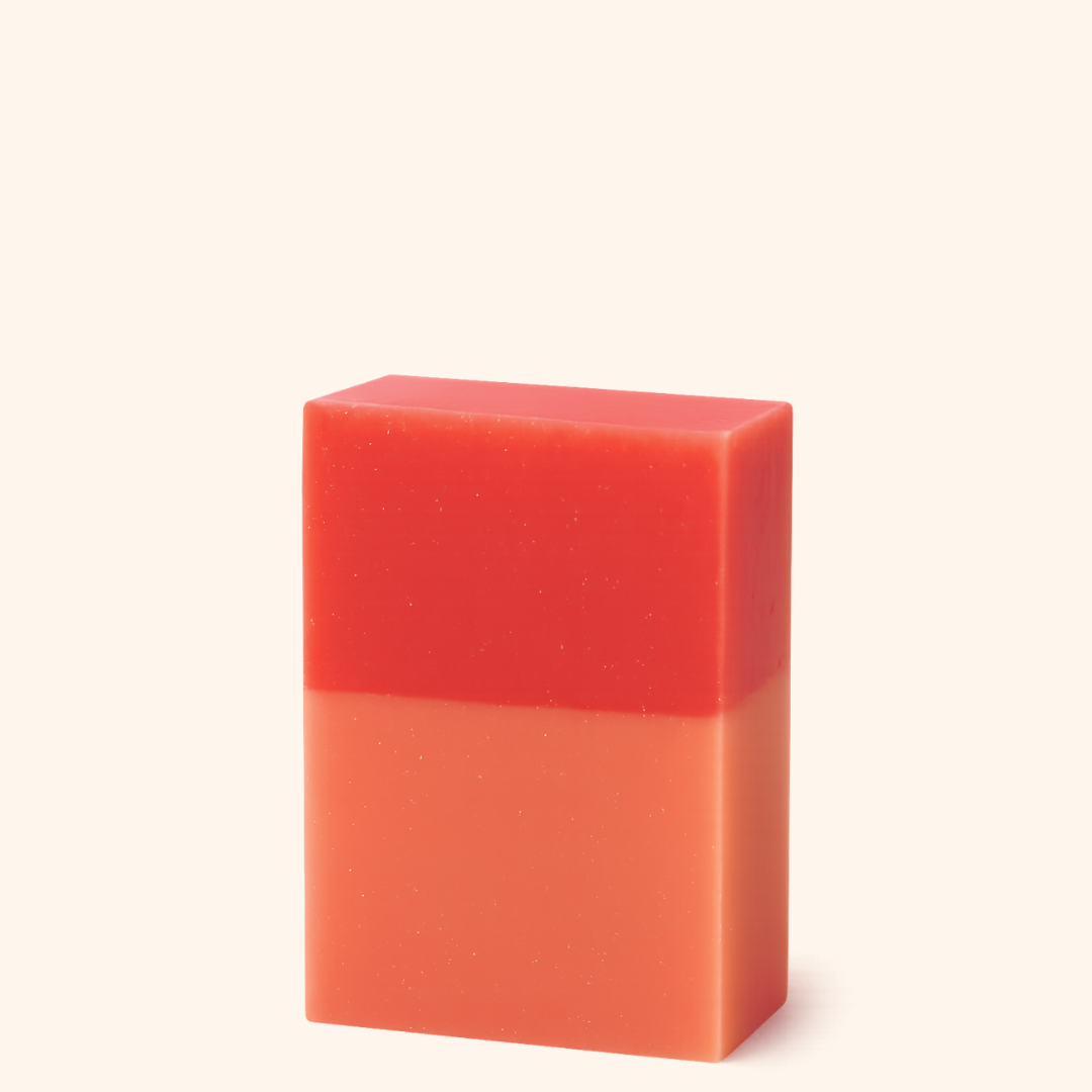 Red and orange gradient bar of soap on a white background