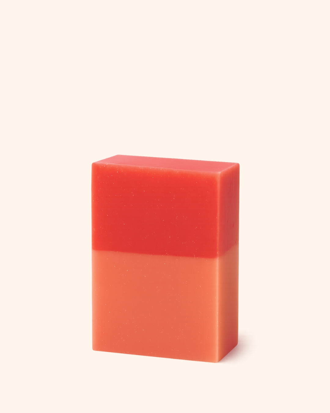 Red and orange gradient bar of soap on a white background