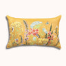 Decorative pillow with floral design on a yellow background