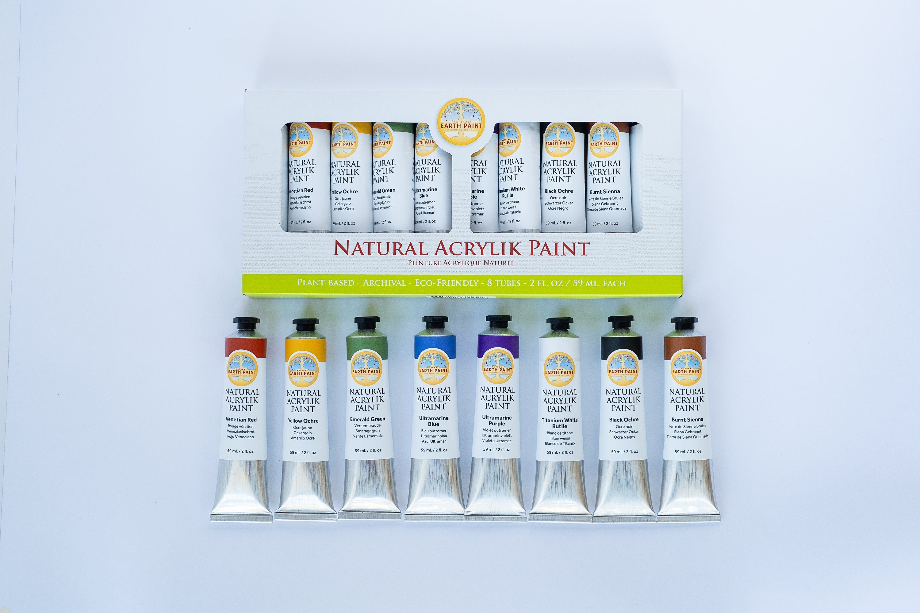 Set of Natural Acrylic Paint tubes with packaging on a light blue background