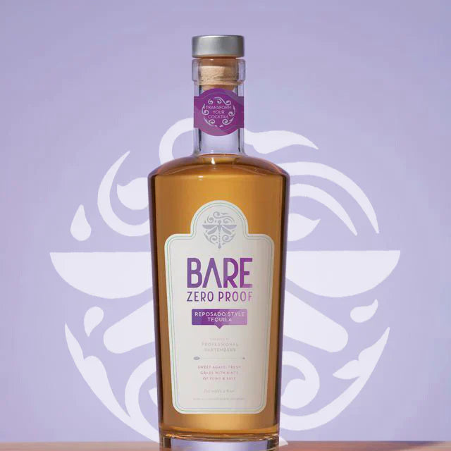 Bottle of Bare Zero Proof on a wooden surface with a purple background