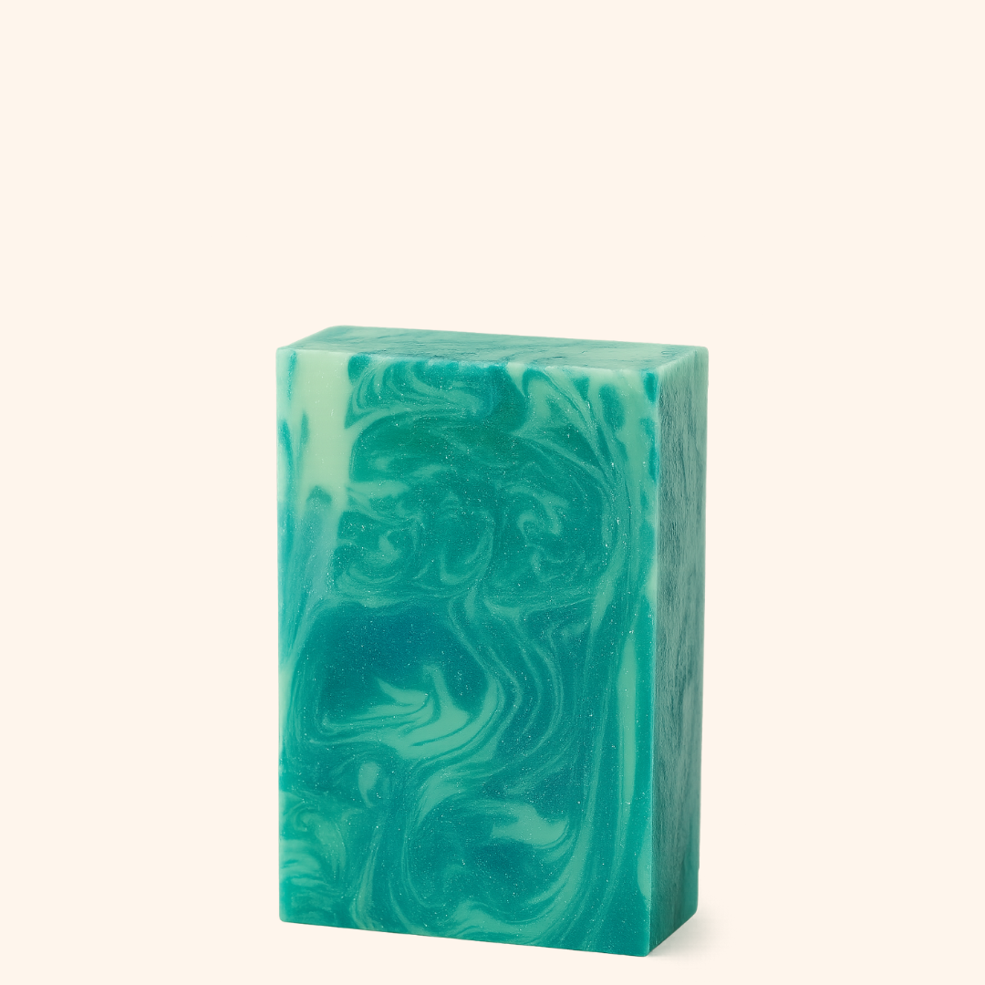 Green marbled soap bar on a white background