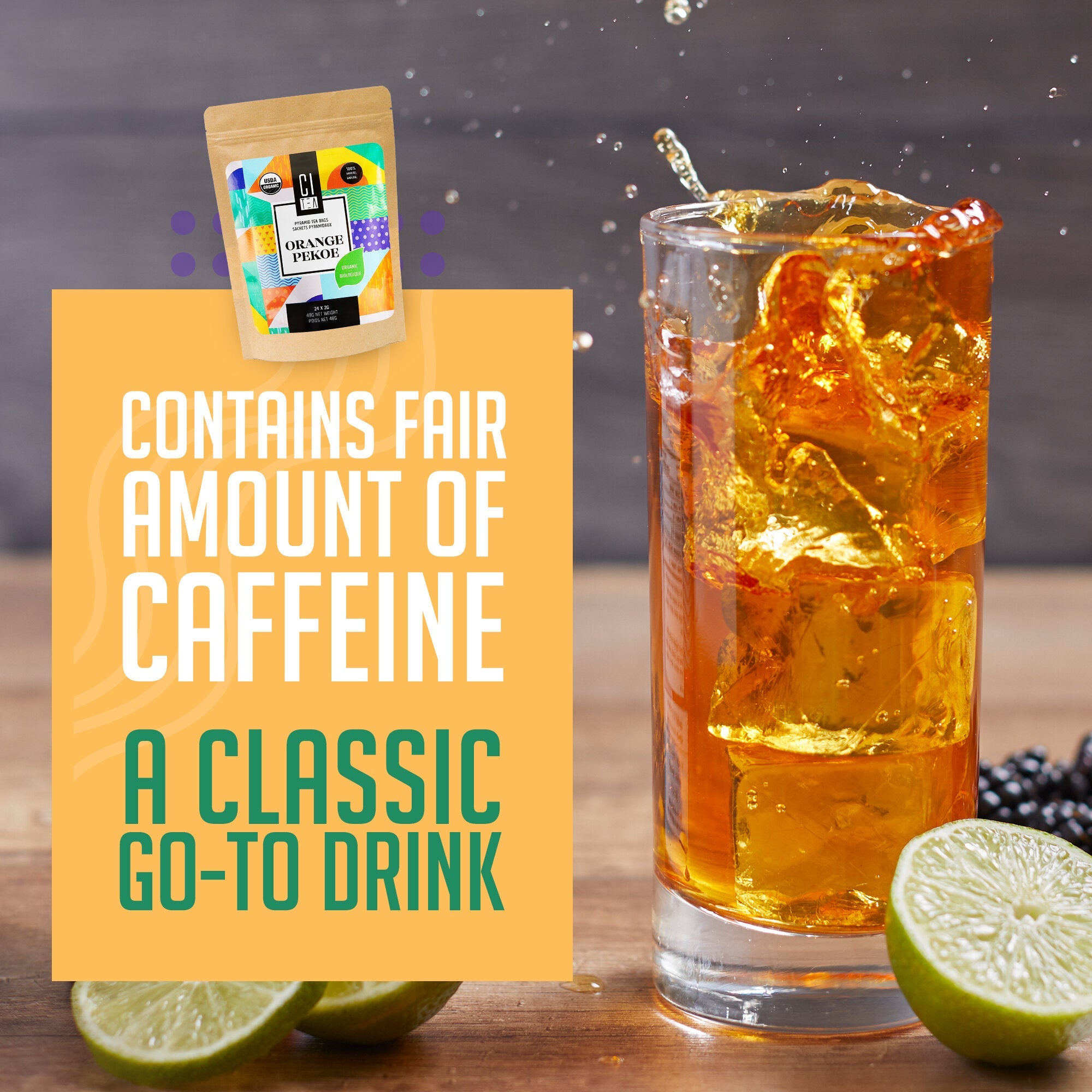 Glass of iced tea with a lime wedge, blackberries, and a packet labeled 'Organic Pickles' on a wooden surface.