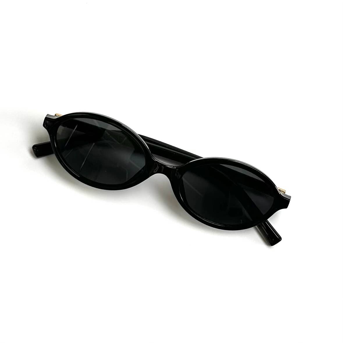 Oversized black framed black lenses sunglasses folded front view