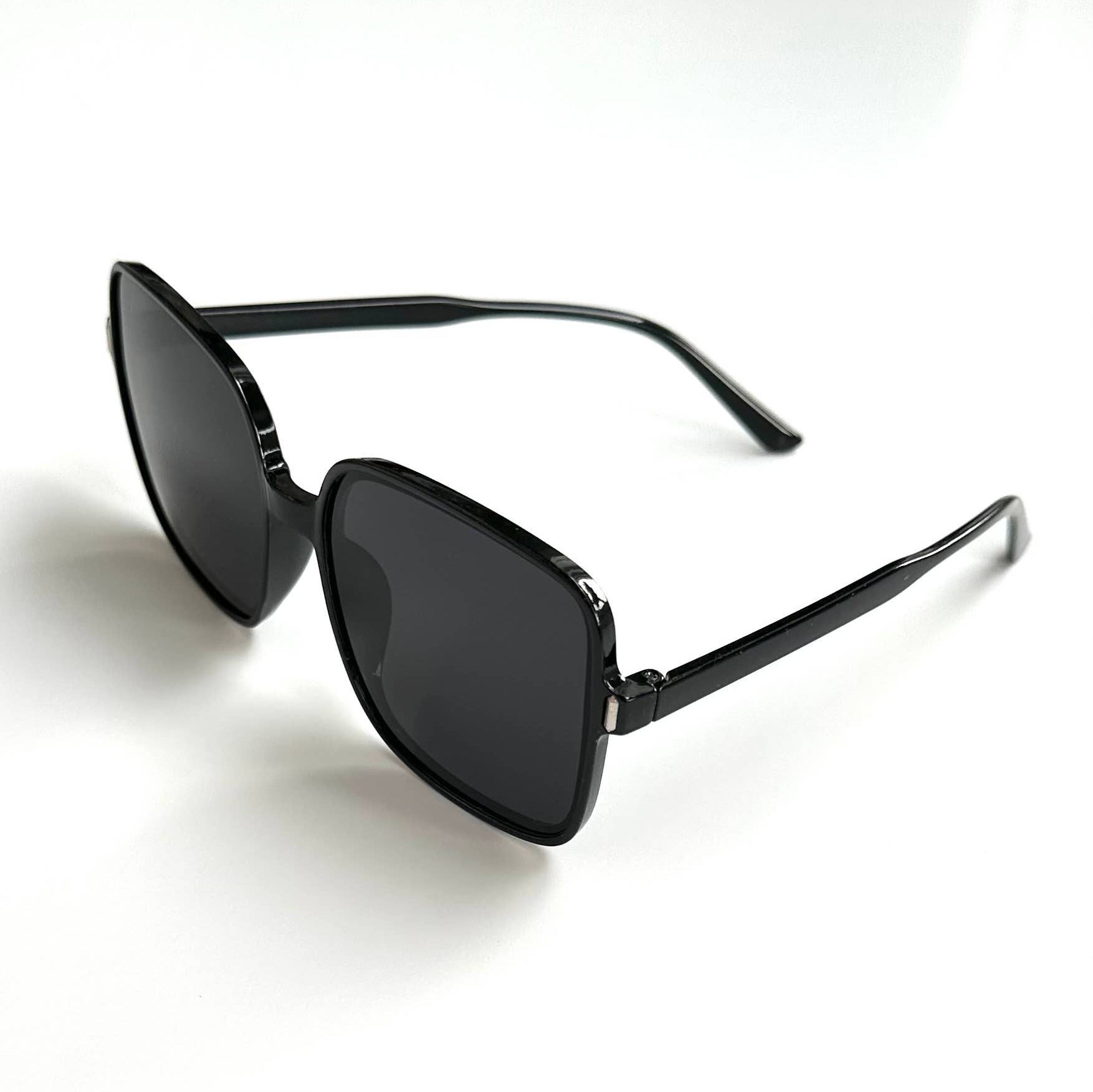 Oversized black framed black lenses sunglasses folded side