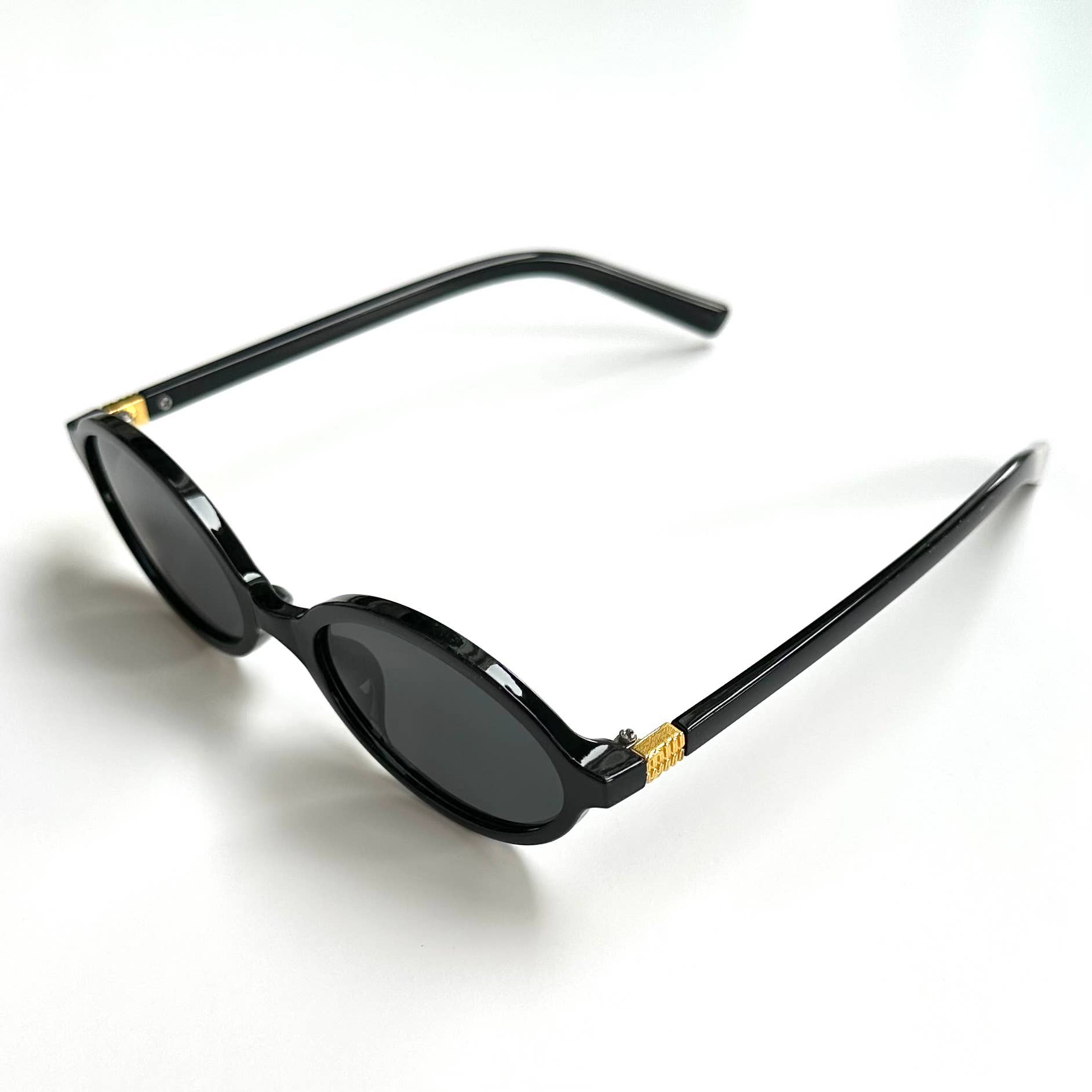 Oversized black framed black lenses sunglasses folded side view