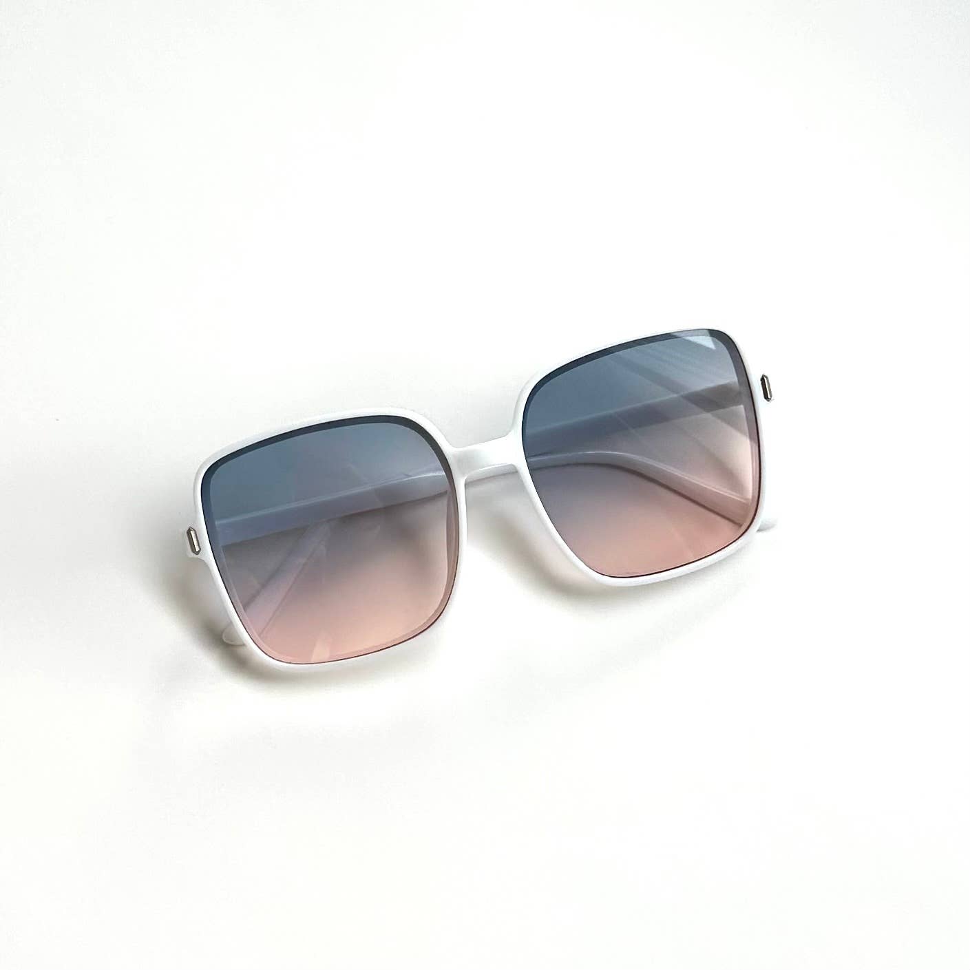 Oversized white framed sunglasses with gradient blue lenses