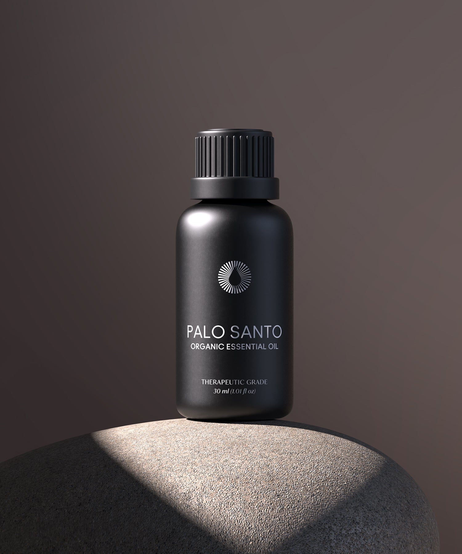 Black bottle of Palo Santo organic essential oil on a dark background