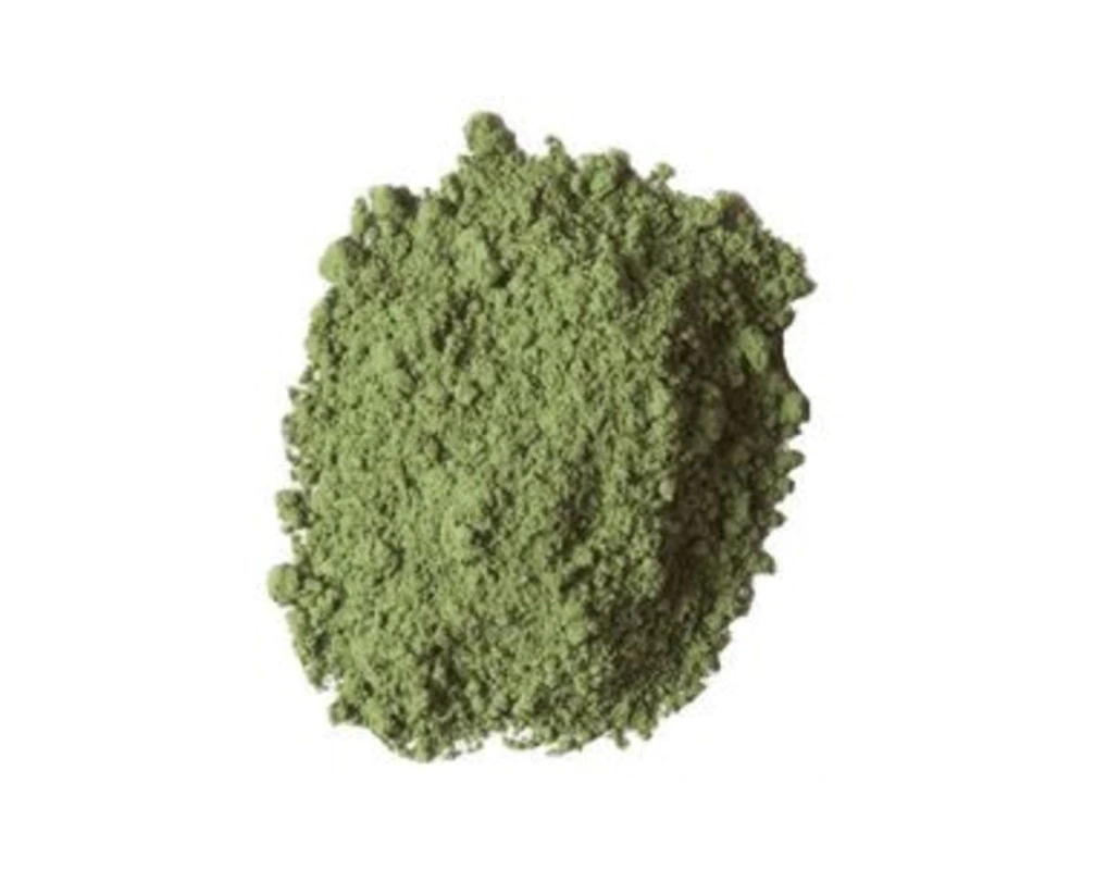 Green powder on a white background