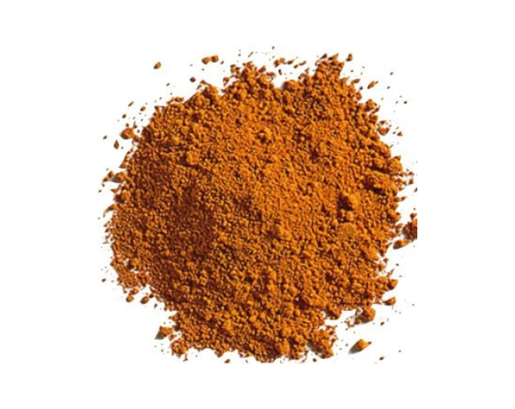 Orange spice powder on a white background