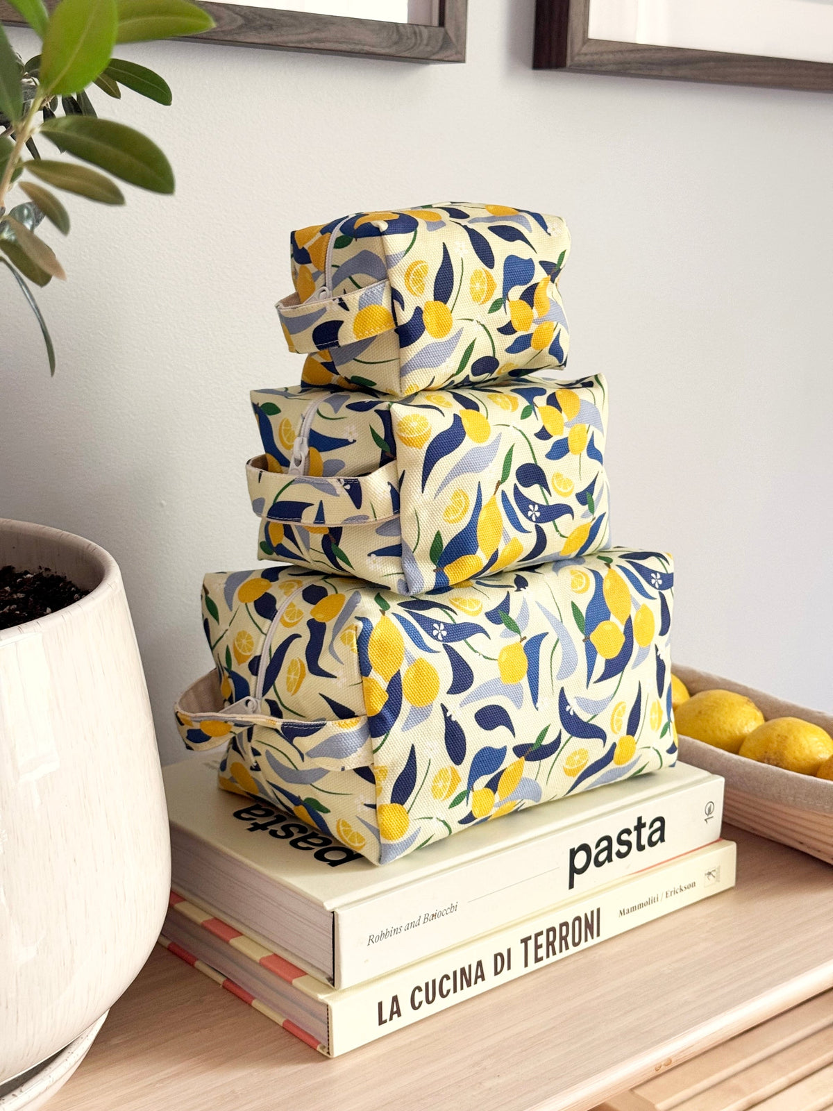 Three lemon themed stacked make up bags by Freon Collective