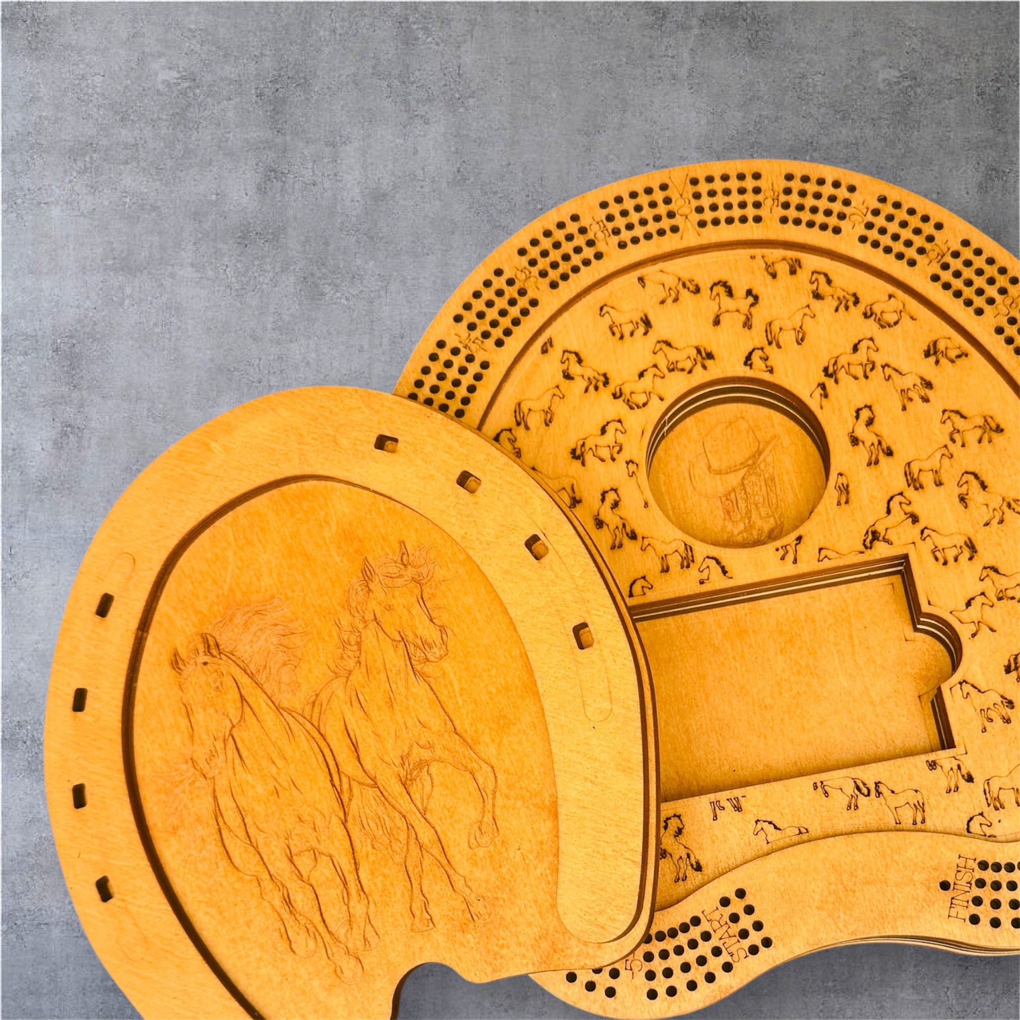 Two wooden c排 boards with horse designs on a gray background