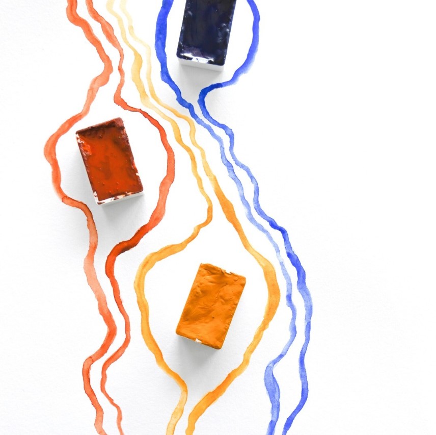 Three rectangular objects with wavy lines of different colors on a white background