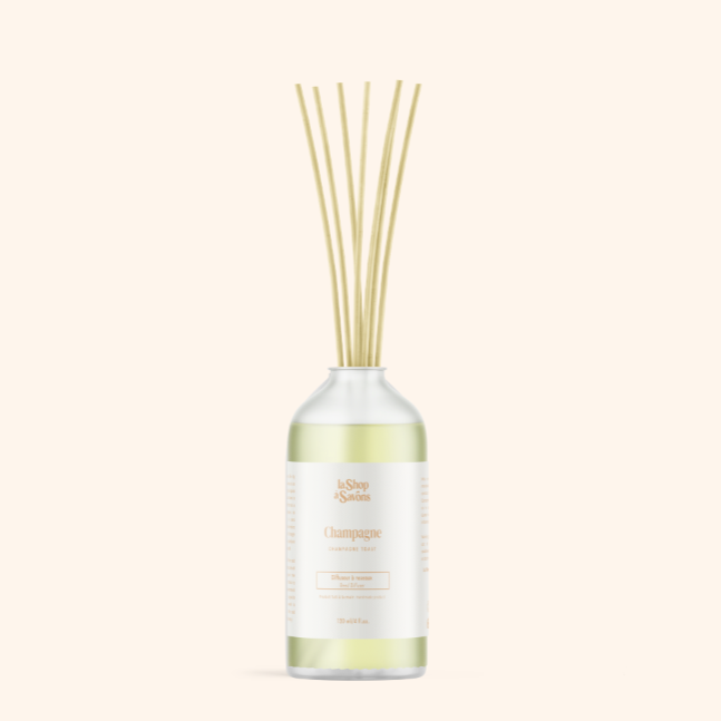 Diffuser with wooden sticks on a white background