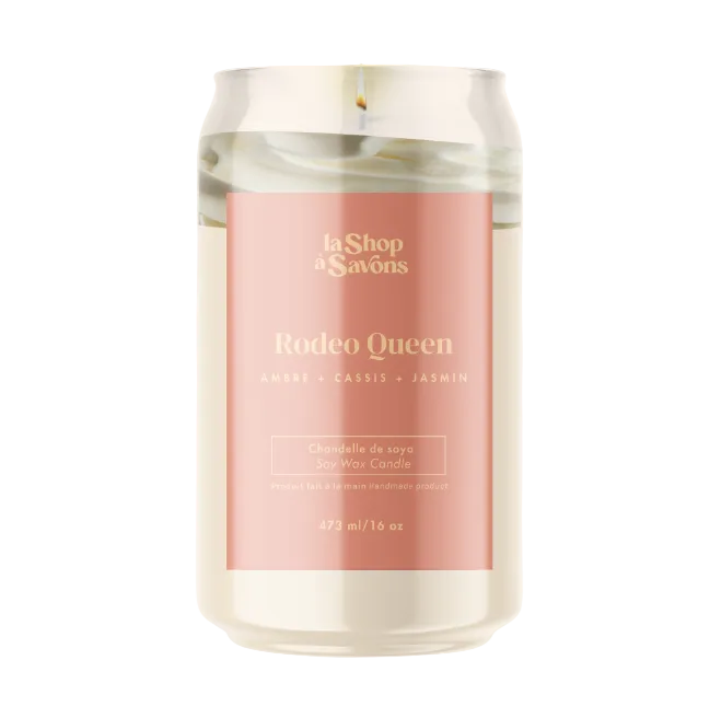 Candle with a pink label featuring 'Rodeo Queen' on a white background
