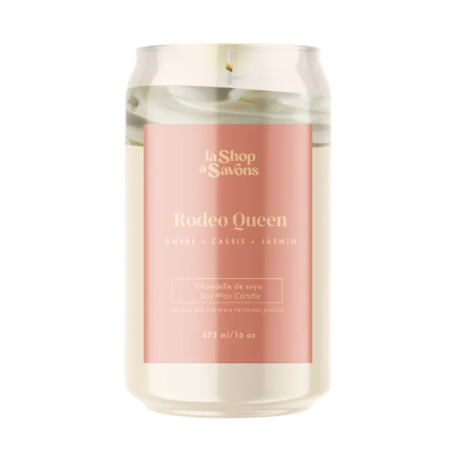 Candle with a pink label featuring 'Rodeo Queen' on a white background