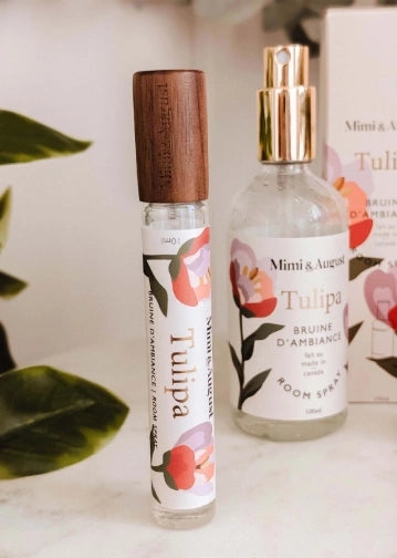 Two Mimi & August Tulipa room sprays on a surface with a blurred background
