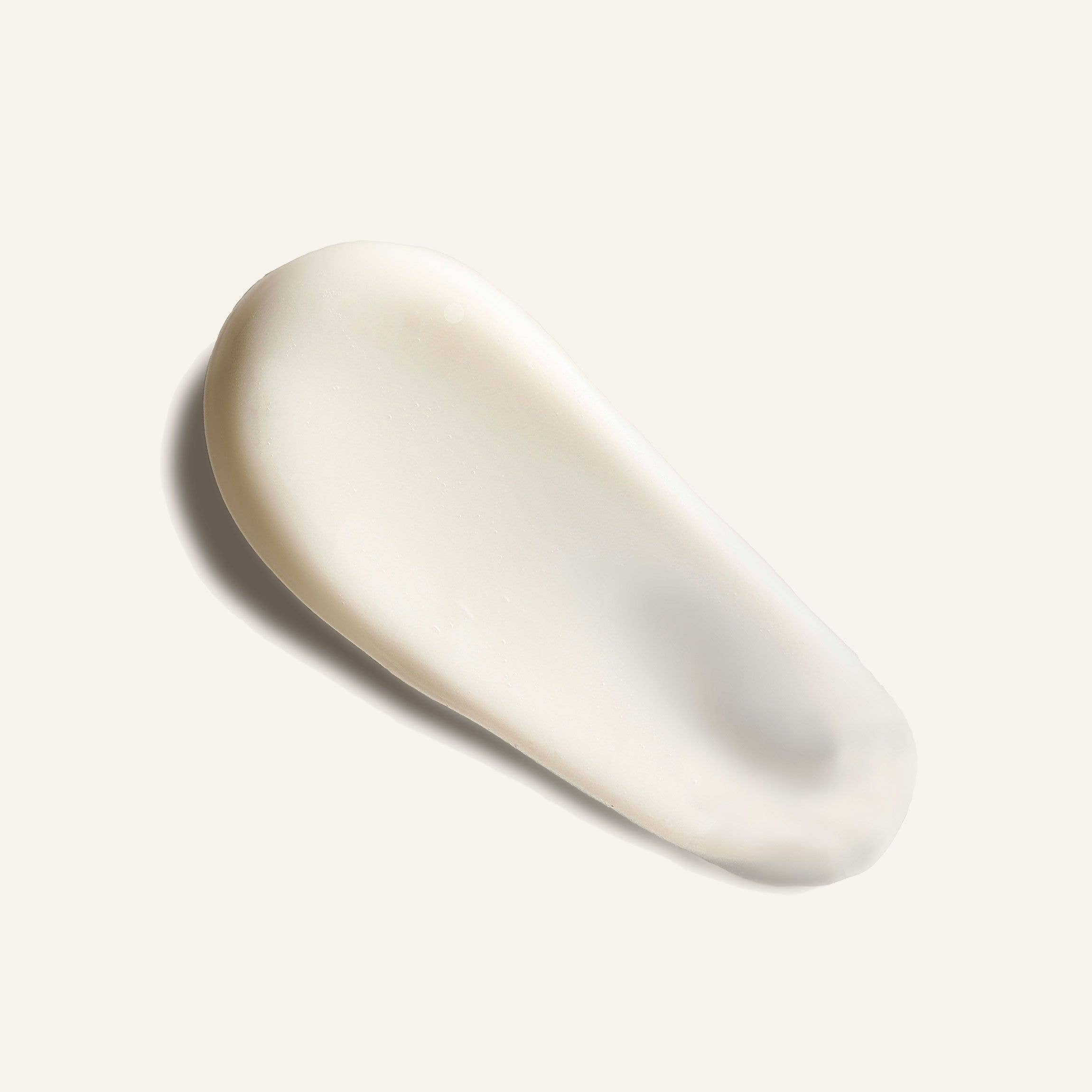 Creamy texture of Routine - Maggie's Farm Natural Body Cream on a neutral background.