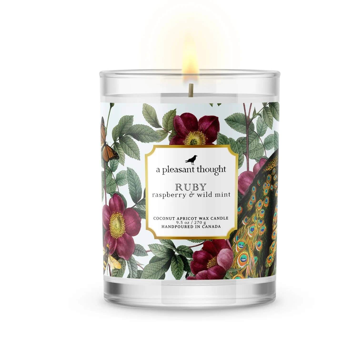 Ruby raspberry & wild mint candle in clear glass votive, featuring floral design and wooden wick for a luxurious experience.