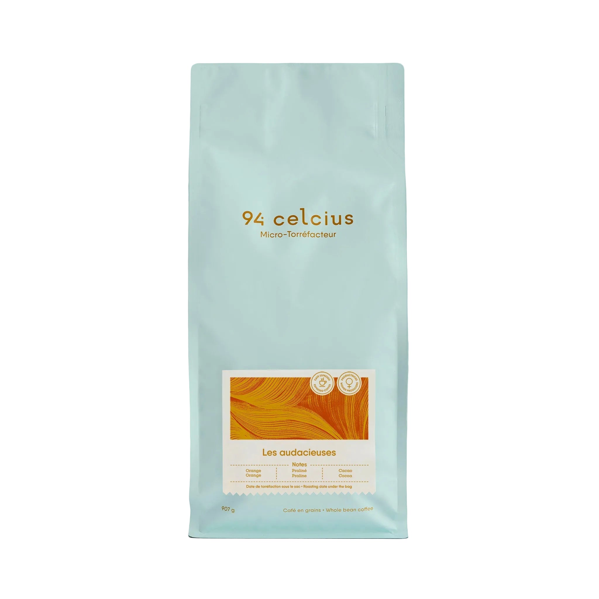 A light blue coffee bag from the brand 94 celcius, featuring an orange and cream label on the front, set against a solid light blue background.