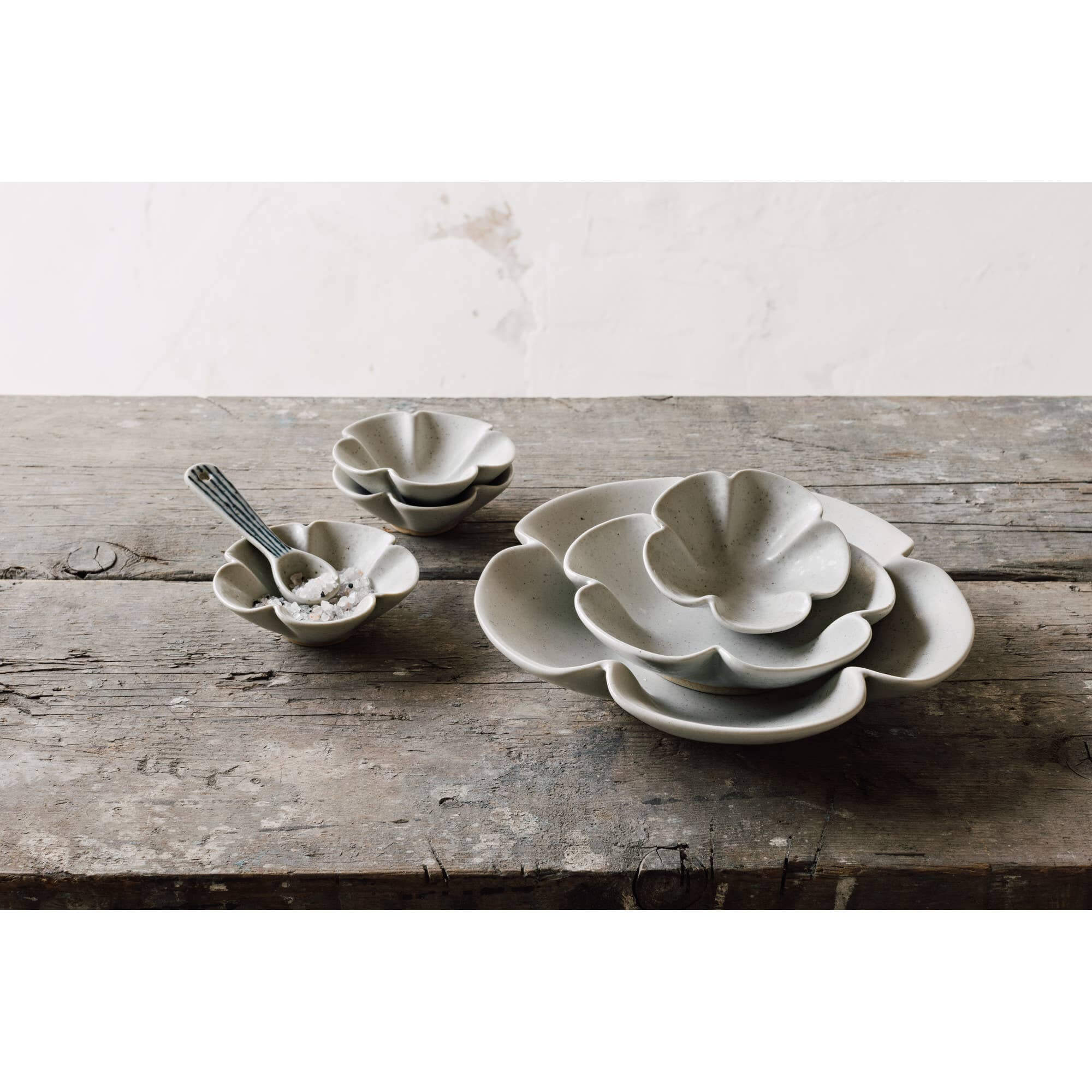 Sakura Pinch Bowls Set of 4 showcasing elegant cherry blossom design on a rustic wooden surface.