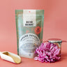 Tea package labeled 'Bush Berry Immune Defence' with a pink flower on a pink background