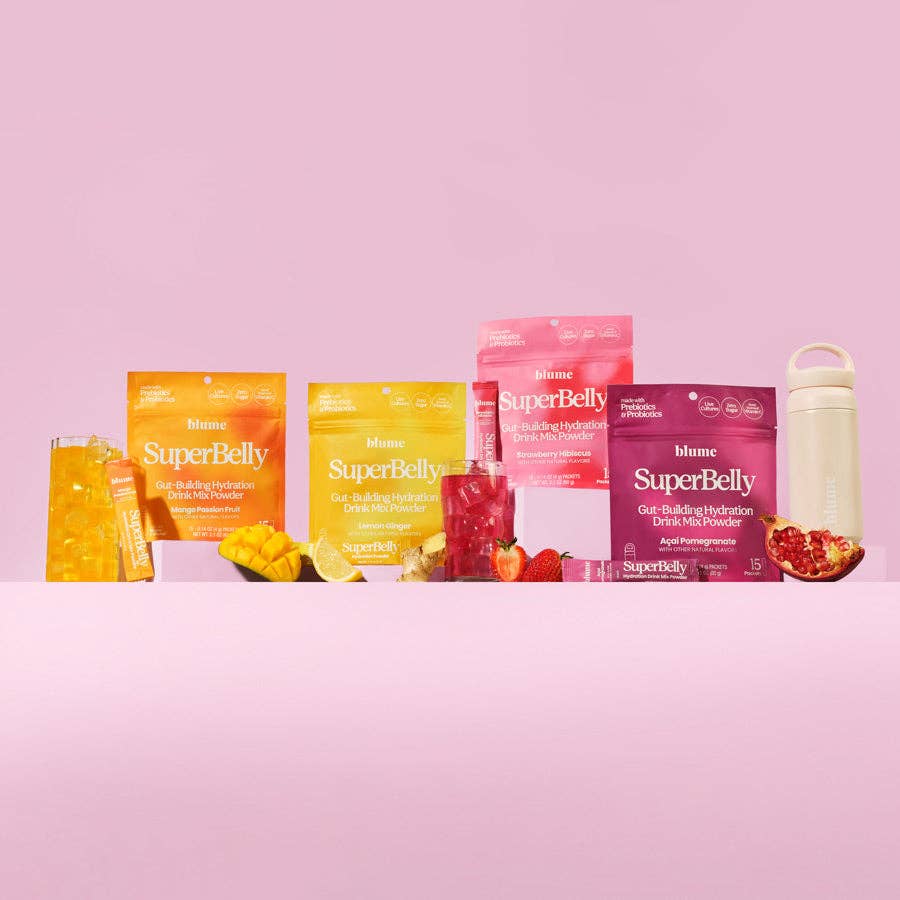 SuperBelly hydration gut health mixes in colorful packaging, with refreshing drinks and a shaker on a pink background.