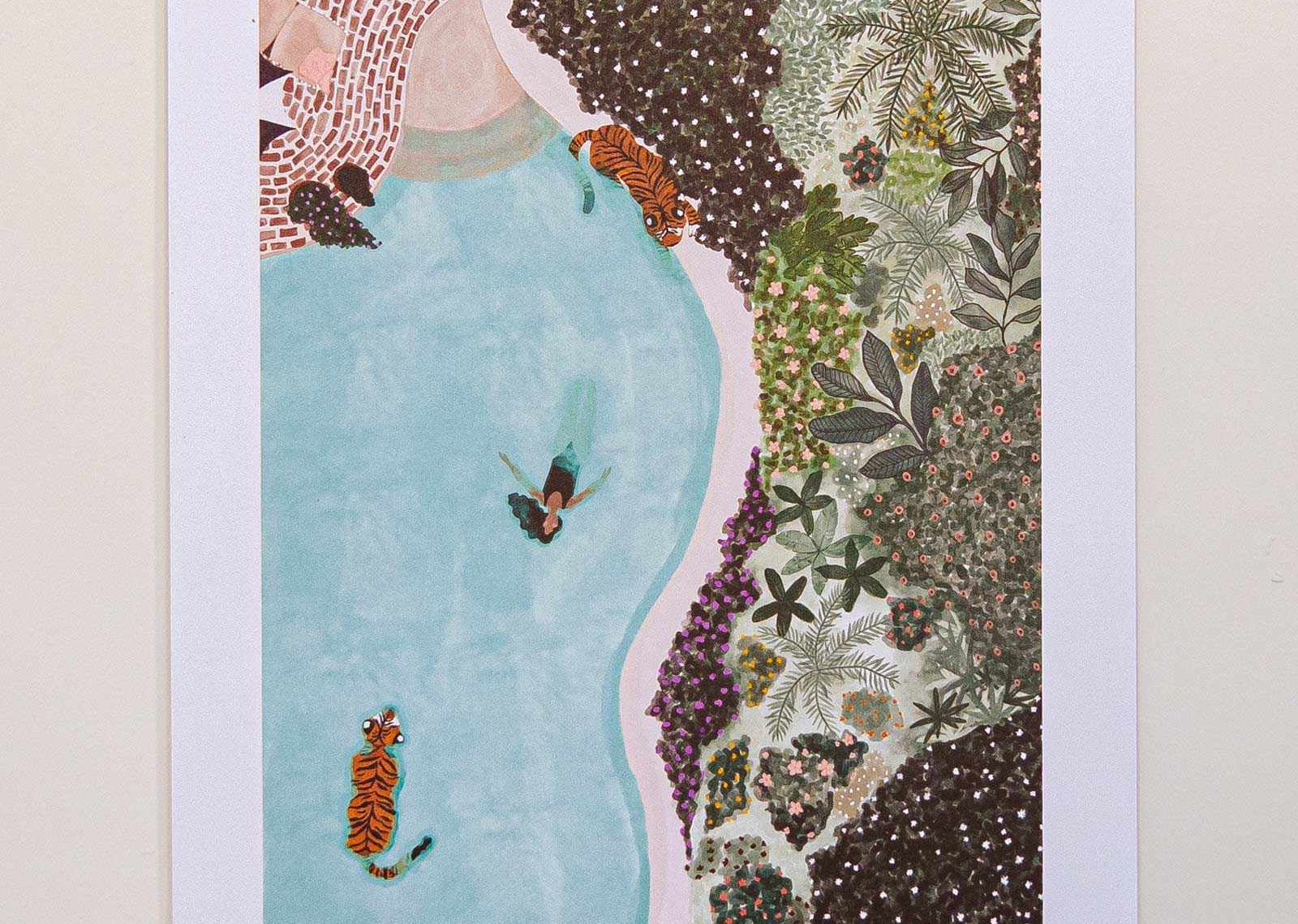 Framed artwork with a woman in a blue dress surrounded by nature elements on a white wall.