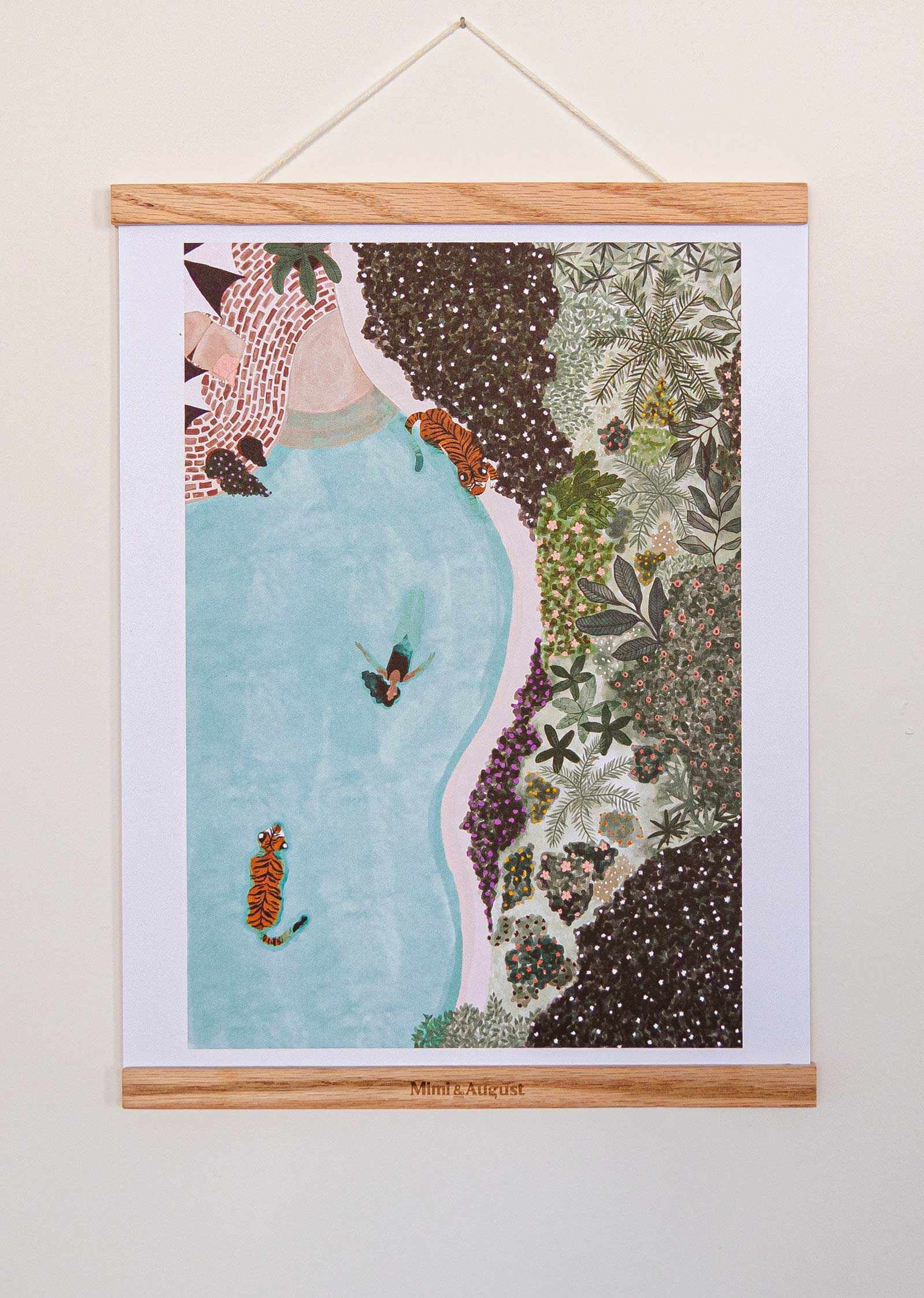 Framed artwork with a woman in a blue dress surrounded by nature elements on a white wall.
