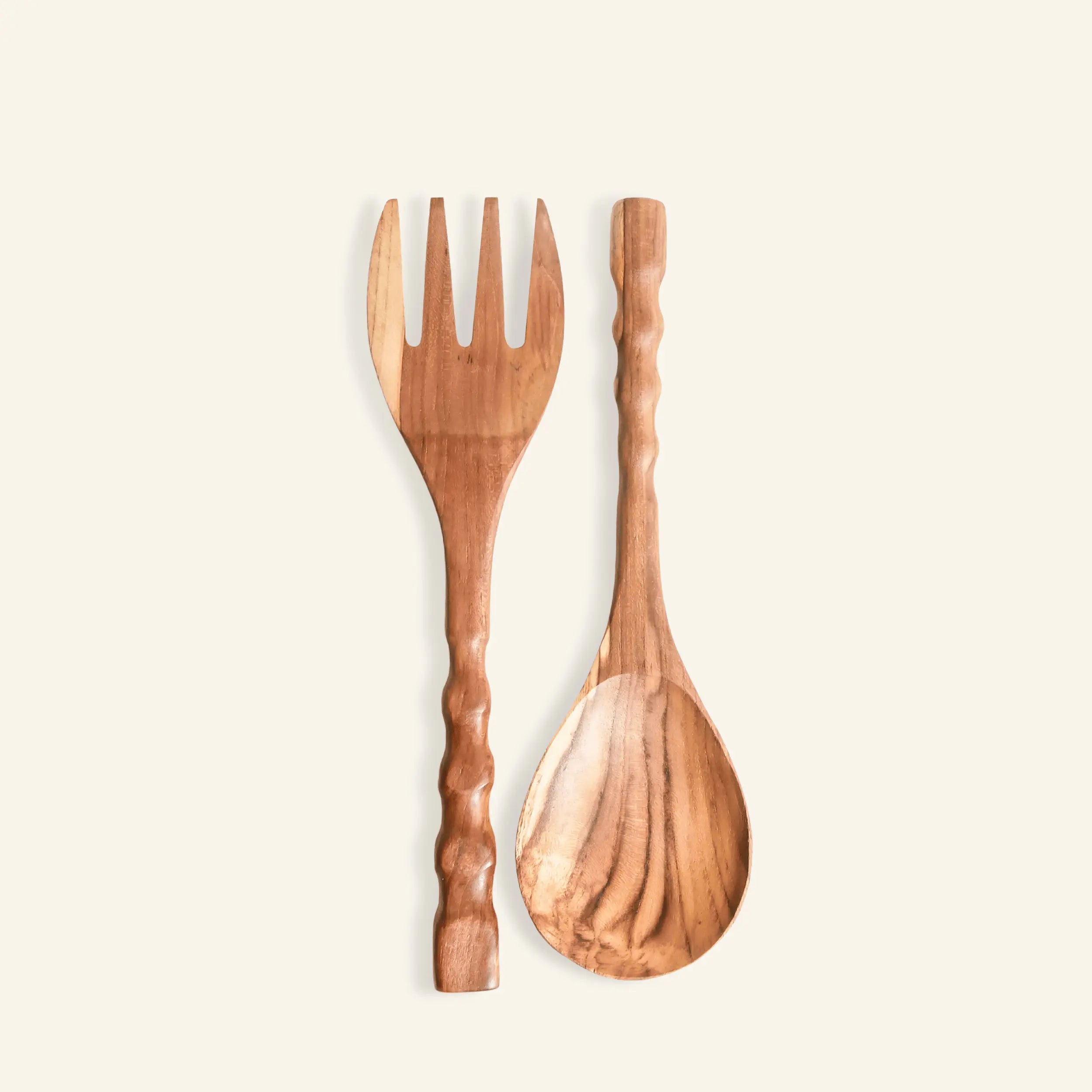 Teak Wood Salad Utensils fork and spoon set on a light beige background