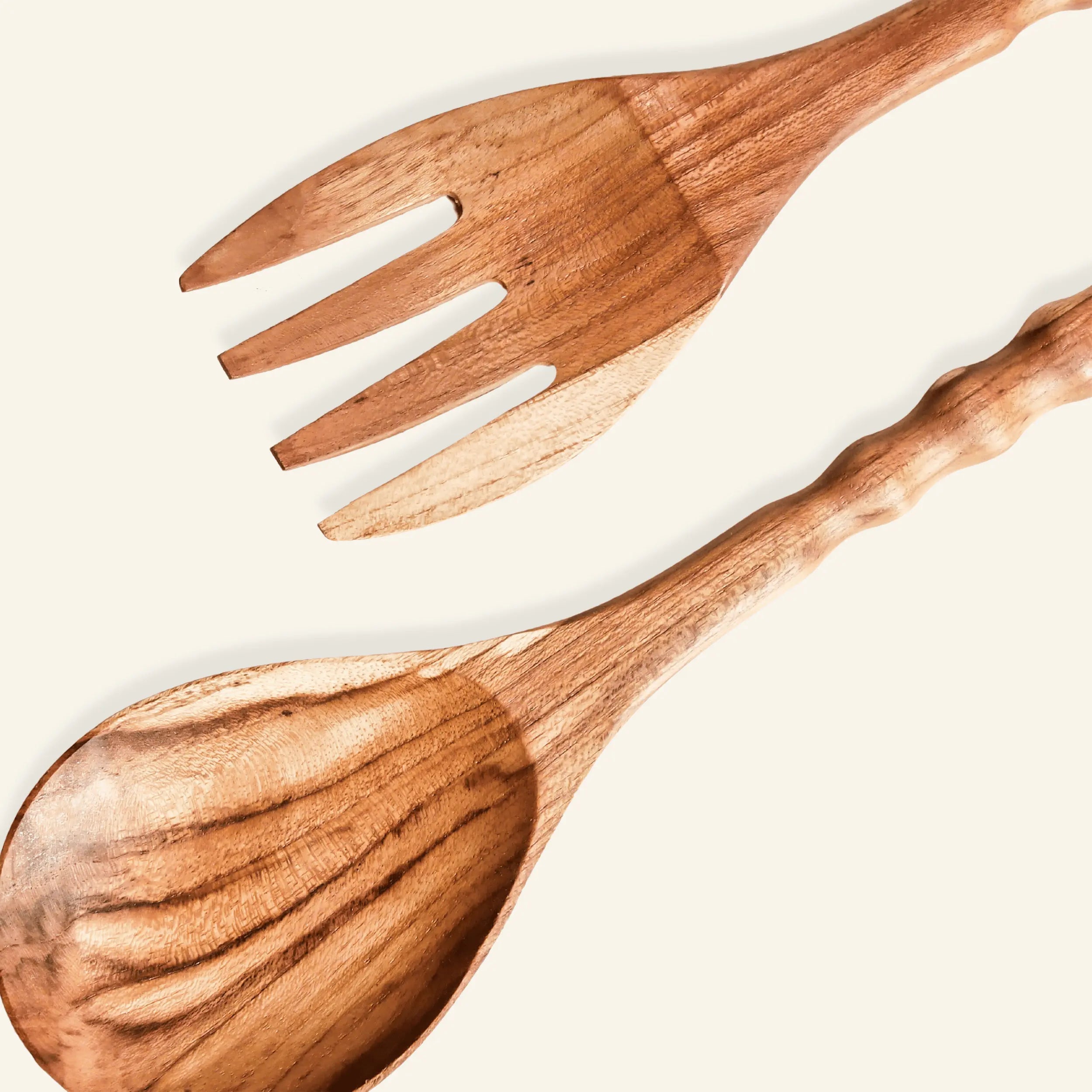 Teak Wood Salad Utensils spoon and fork on a light background
