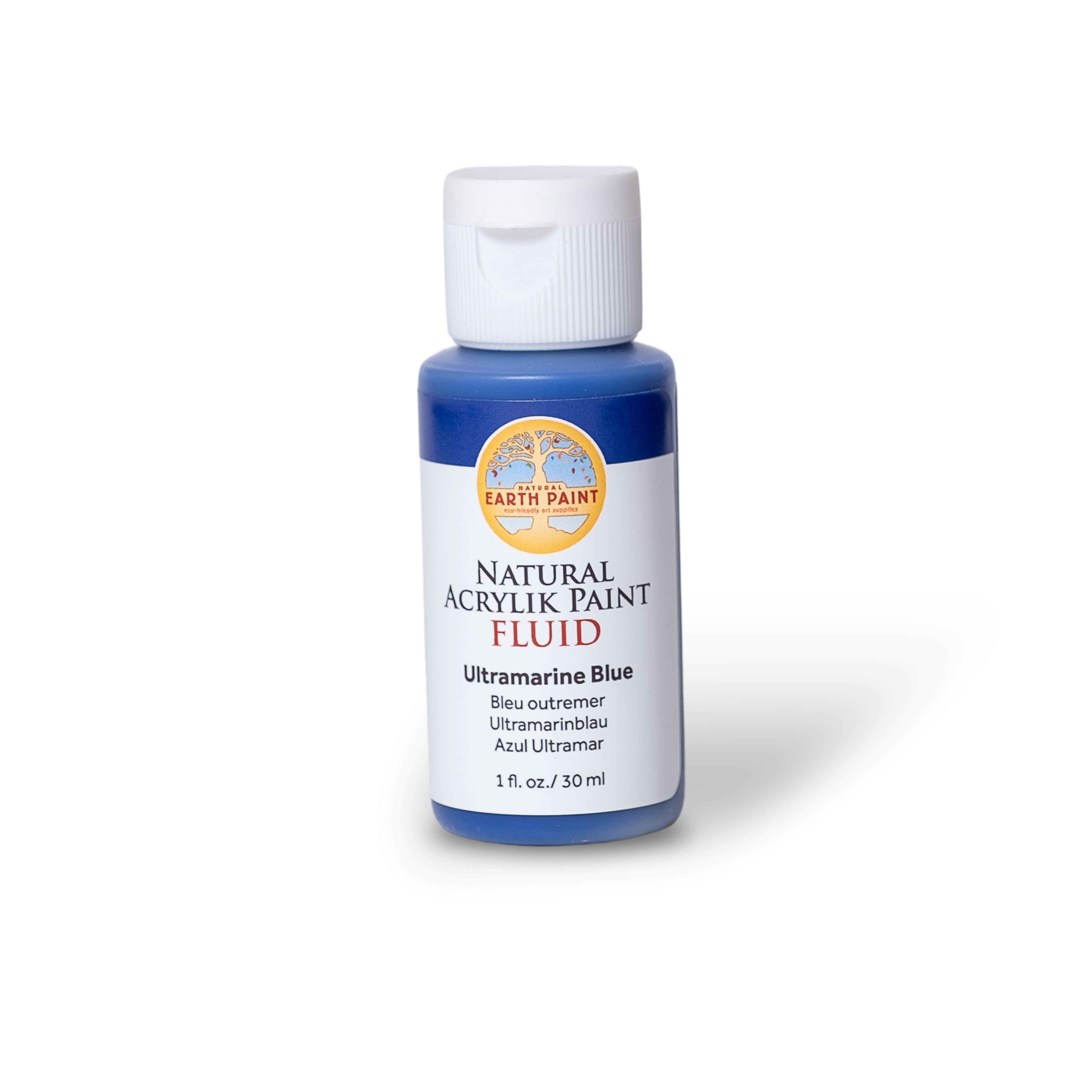 Bottle of ultramarine blue acrylic paint on a white background
